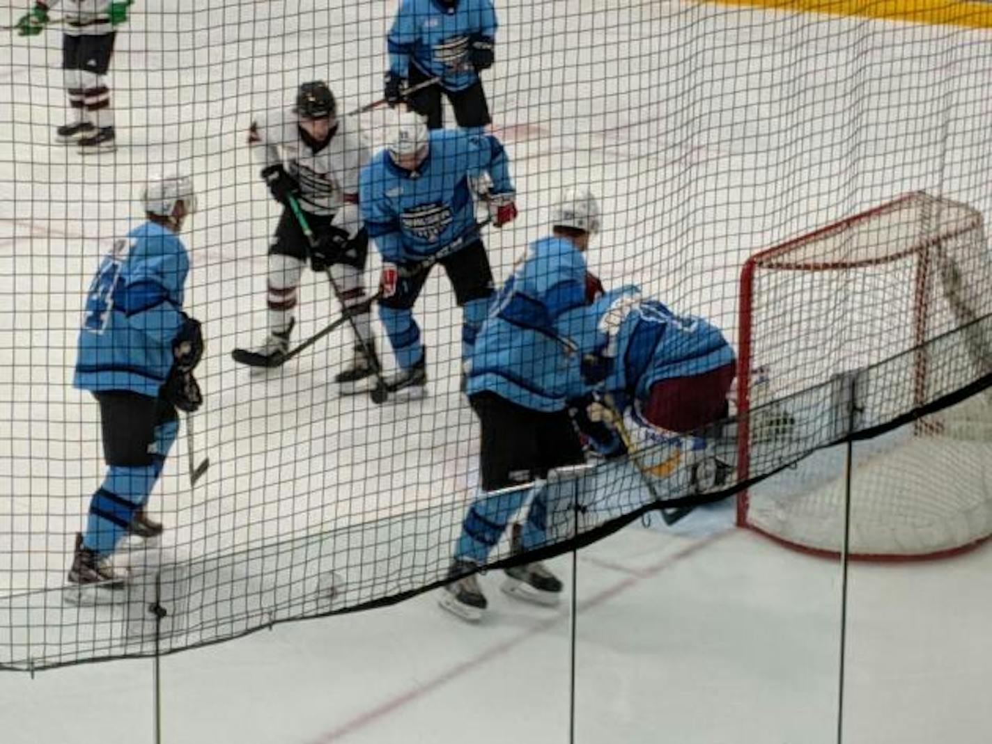 Players from Team Walser (in blue) and Team Tradition battled for the puck during Da Beauty League play on Wednesday, July 24, at Braemar Arena in Edina. The league next plays on July 31 and then will run Mondays and Wednesdays through Aug. 21.