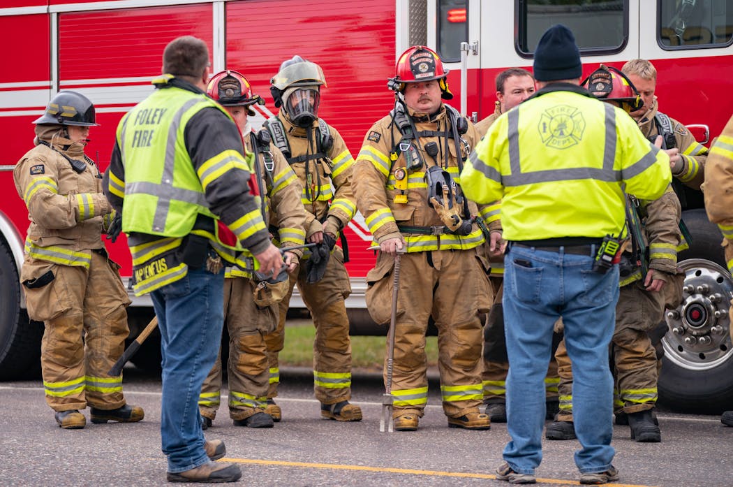 Firefighters met before heading to the site where law enforcement was gathered outside of a residence where a man suspected of shooting multiple officers was in a standoff Thursday near Princeton.