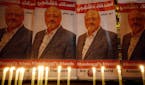 FILE - In this Oct. 25, 2018, file photo, candles lit by activists protesting the killing of Saudi journalist Jamal Khashoggi are placed outside Saudi