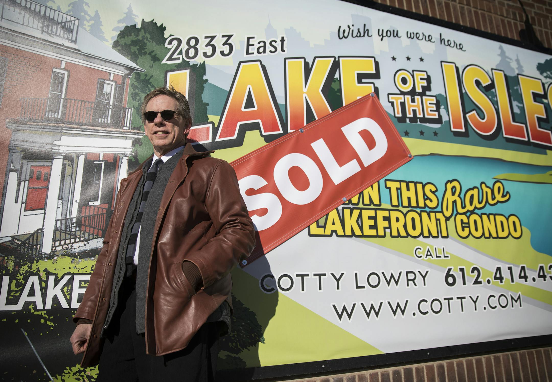 Cotty Lowry, standing in front of his ever-changing billboard, is the the 2017 president of the Minneapolis Area Association of Realtors.