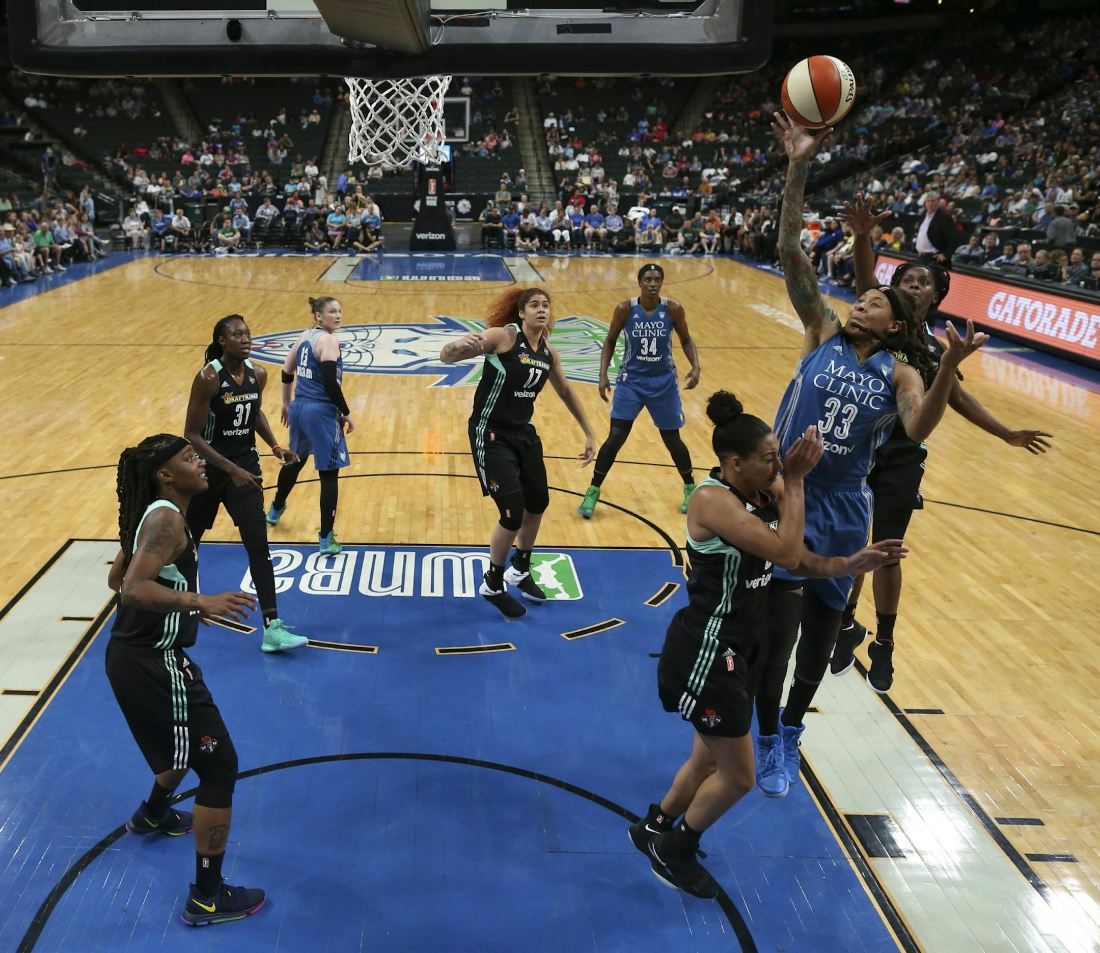 Minnesota Lynx guard Seimone Augustus (33) scored over New York Liberty guard Bria Hartley (8) in the first half.