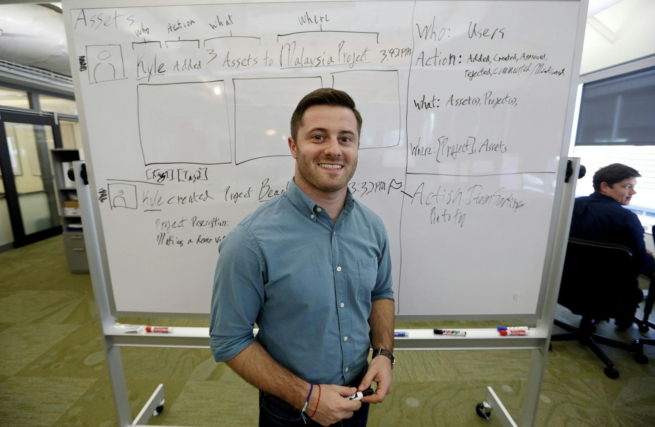 In this May 4, 2015 photo, Dan Bloom, owner of Slope, poses for photos in his workspace at the offices of Microsoft Ventures in Seattle. Microsoft has given Creative Worx $25,000, work space, technical advice and feedback from Microsoft employees as part of its Ventures program. (AP Photo/Elaine Thompson) ORG XMIT: NYBZ133
