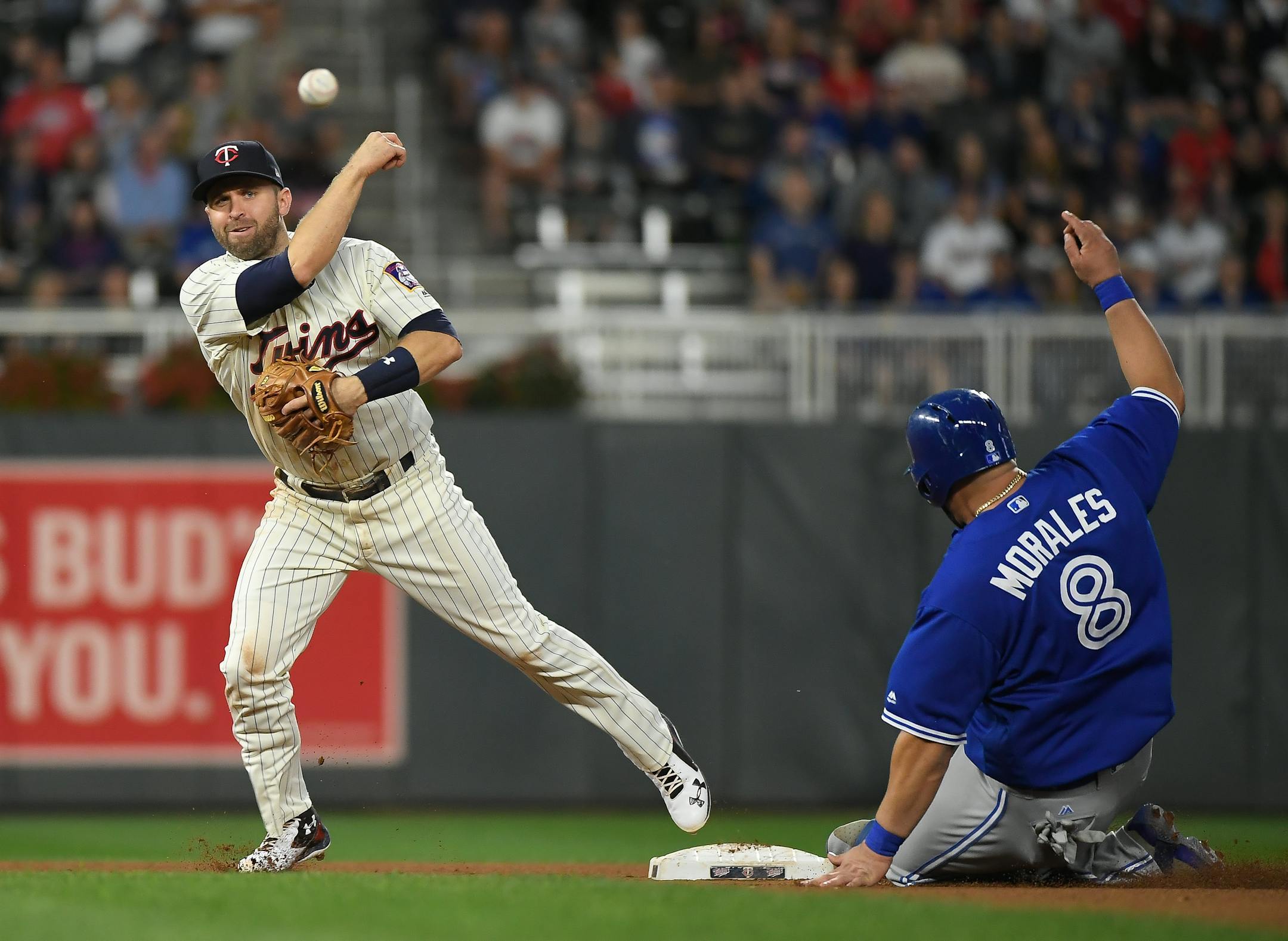 Blue Jays designated hitter Kendrys Morales was out at second as Twins second baseman Brian Dozier turned a double play.