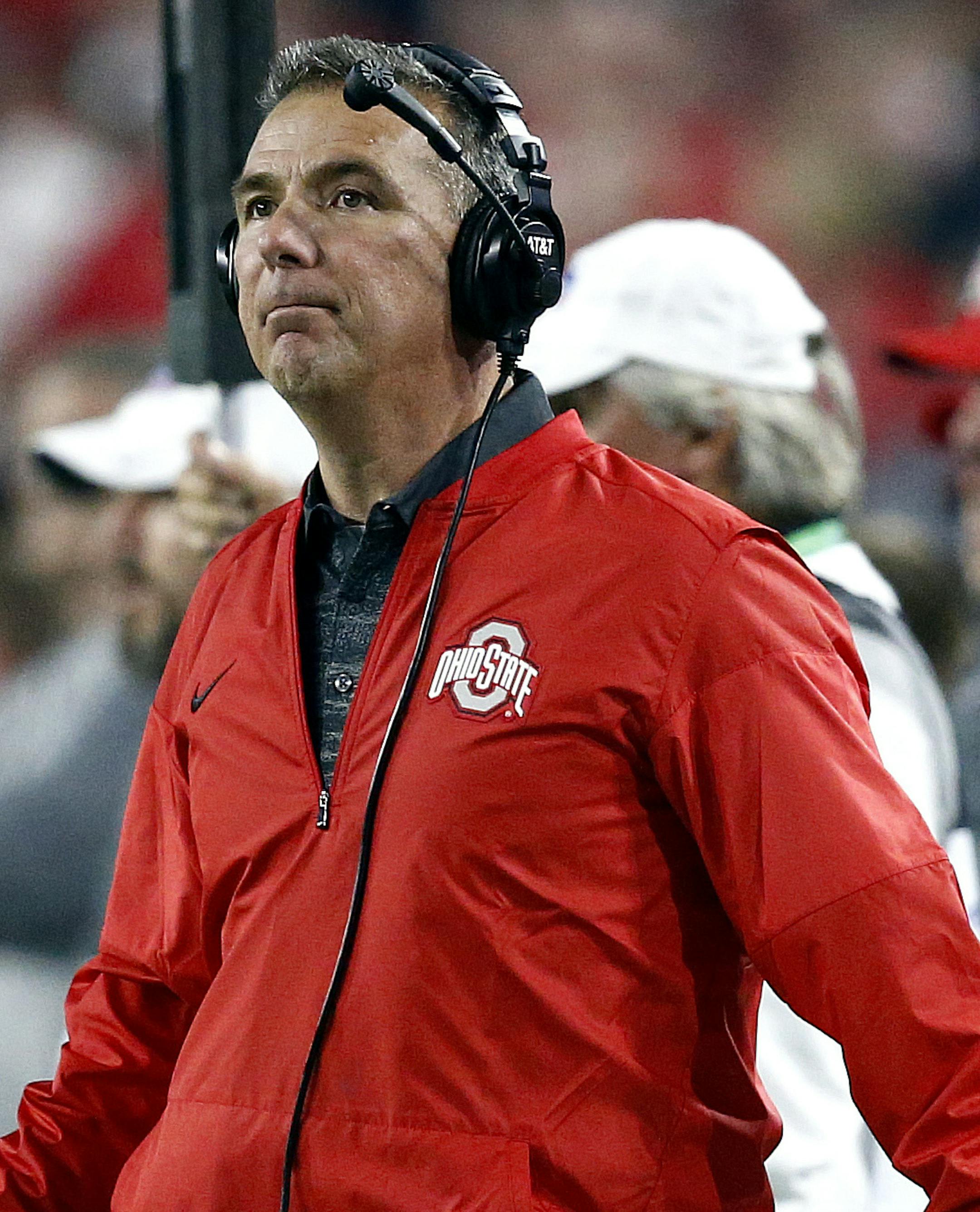 Ohio State coach Urban Meyer looks at the scoreboard during the first half of the team's Fiesta Bowl NCAA college football playoff semifinal against Clemson, Saturday, Dec. 31, 2016, in Glendale, Ariz. (AP Photo/Ross D. Franklin)