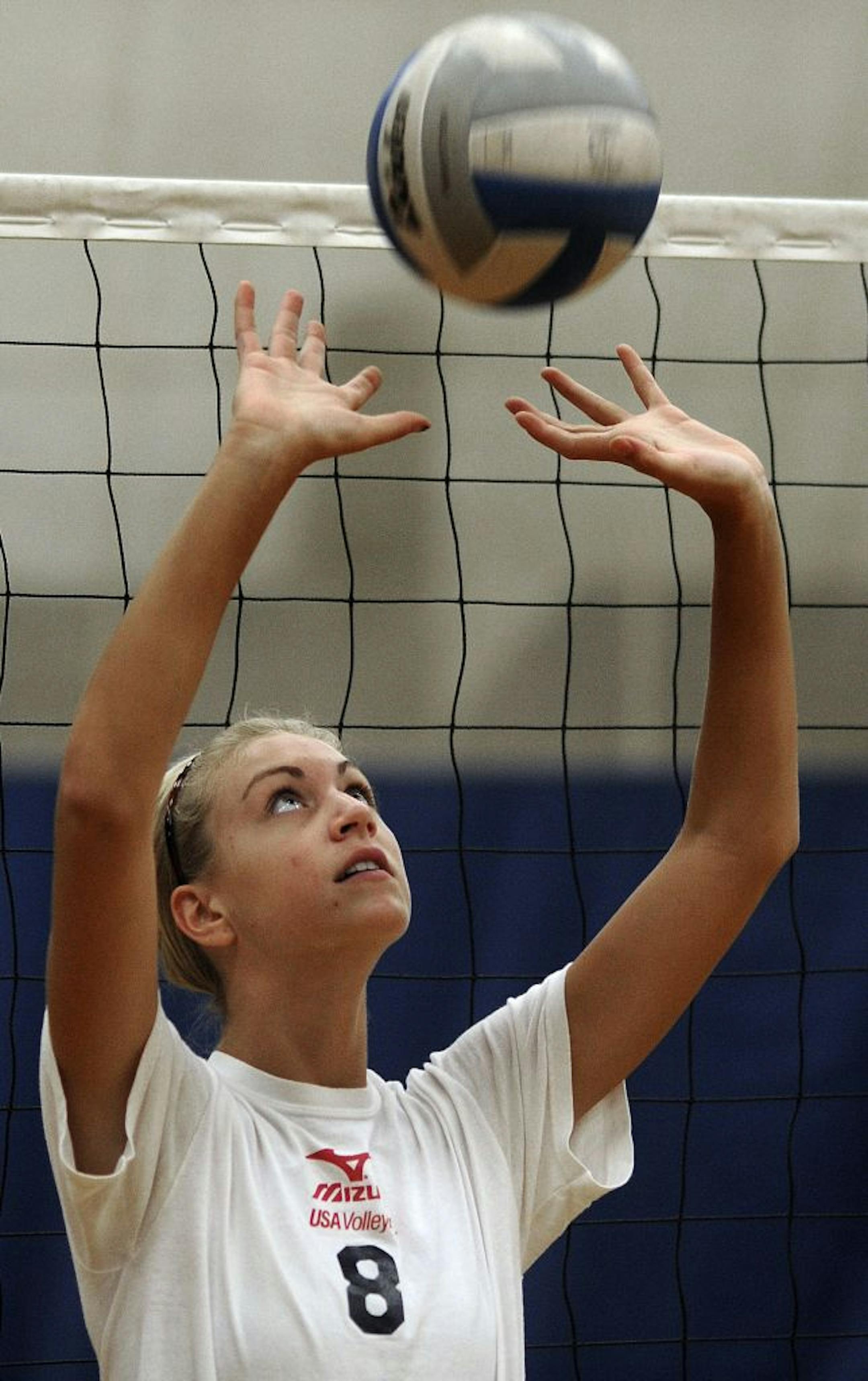 Blaine High School volley ball team member sisters Lydia Dimke practiced on Monday Morning August 22,2011 in Blaine Minn.
