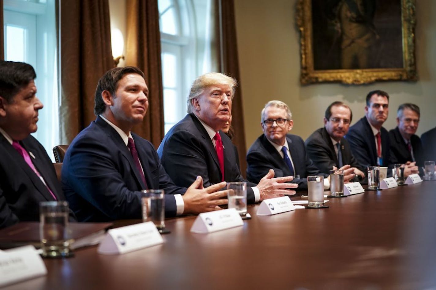 President Donald Trump meets with newly-elected governors at the White House in Washington, Dec. 13, 2018. From left: J.B. Pritzker of Illinois, Ron DeSantis of Florida, Trump and Mike DeWine of Ohio.