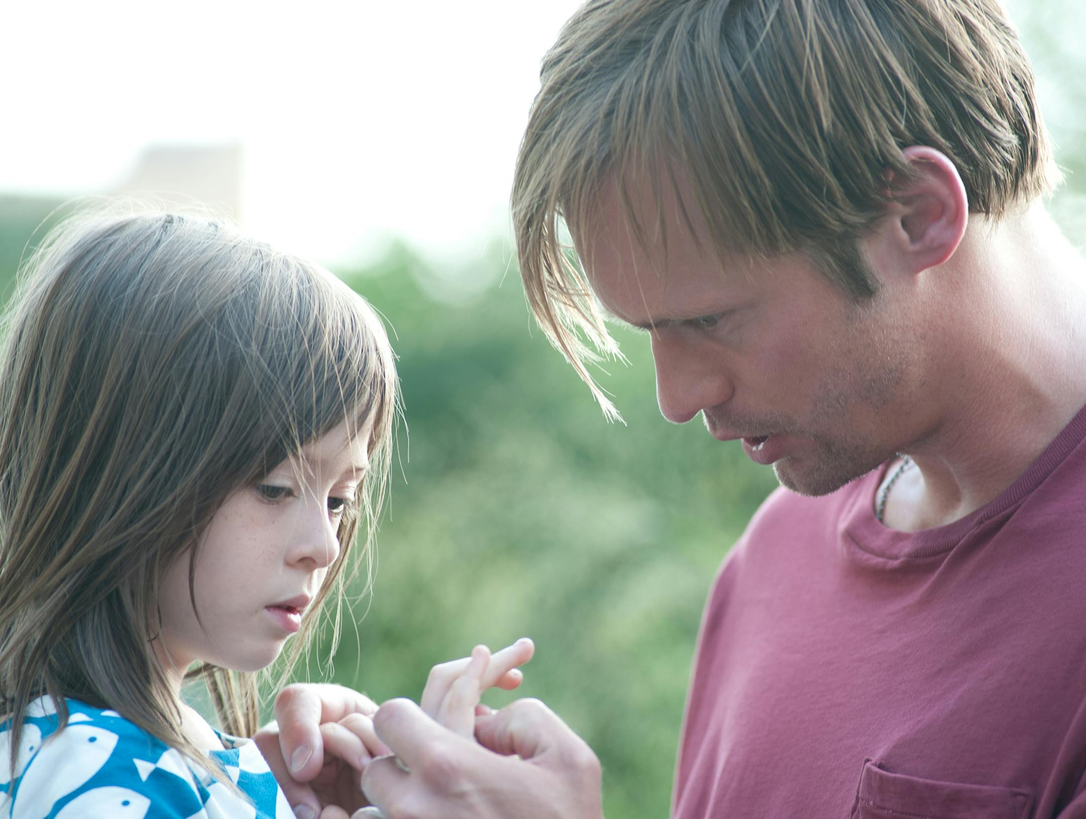 This film image released by Millennium Entertainment shows Onata Aprile, left, and Alexander Skarsgard in a scene from "What Maisie Knew." (AP Photo/Millennium Entertainment, JoJo Whilden) ORG XMIT: MIN2013052009282021 ORG XMIT: MIN1305200942201028
