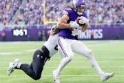 Vikings tight end T.J. Hockenson had a record day against the Saints despite taking shots to his injured ribs, falls and flips.