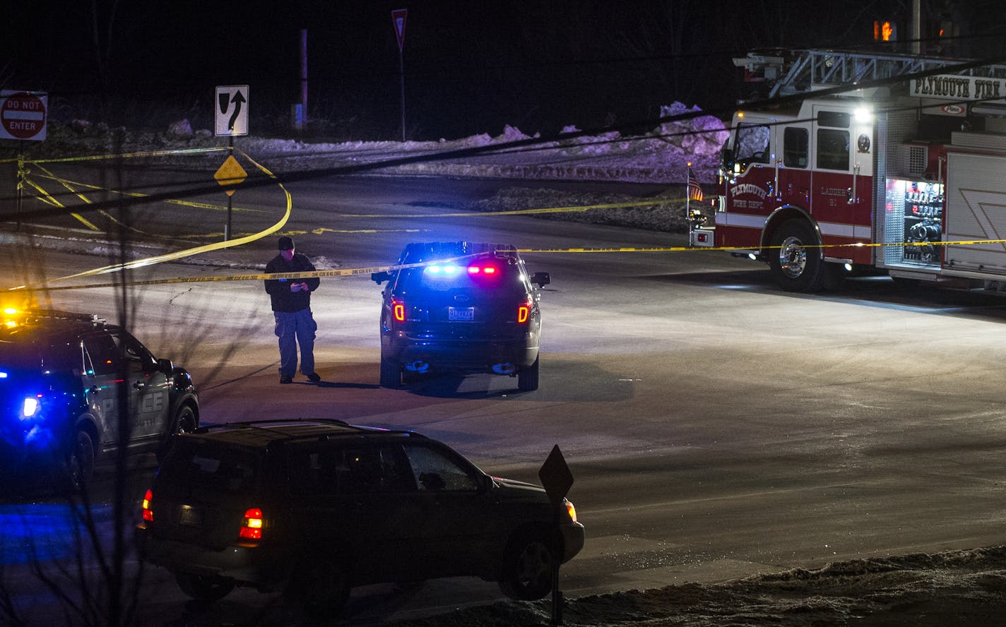 Police and the Plymouth Fire Department blocked off the intersection of Northwest Blvd. and Rockford Road in Plymouth near the site of a body. ] (AARON LAVINSKY/STAR TRIBUNE) aaron.lavinsky@startribune.com Heavy police presence with at least one body on Northwest Blvd. and Rockford Road in Plymouth, Minn. on Saturday, Feb. 13, 2016.