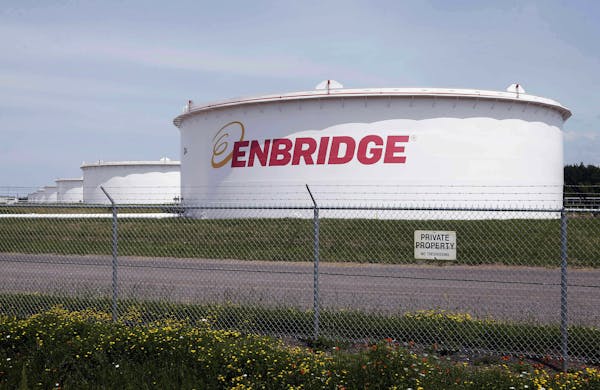 FILE - This June 29, 2018 photo shows tanks at the Enbridge Energy terminal in Superior, Wis. Enbridge Energy's plan to replace its aging Line 3 crude