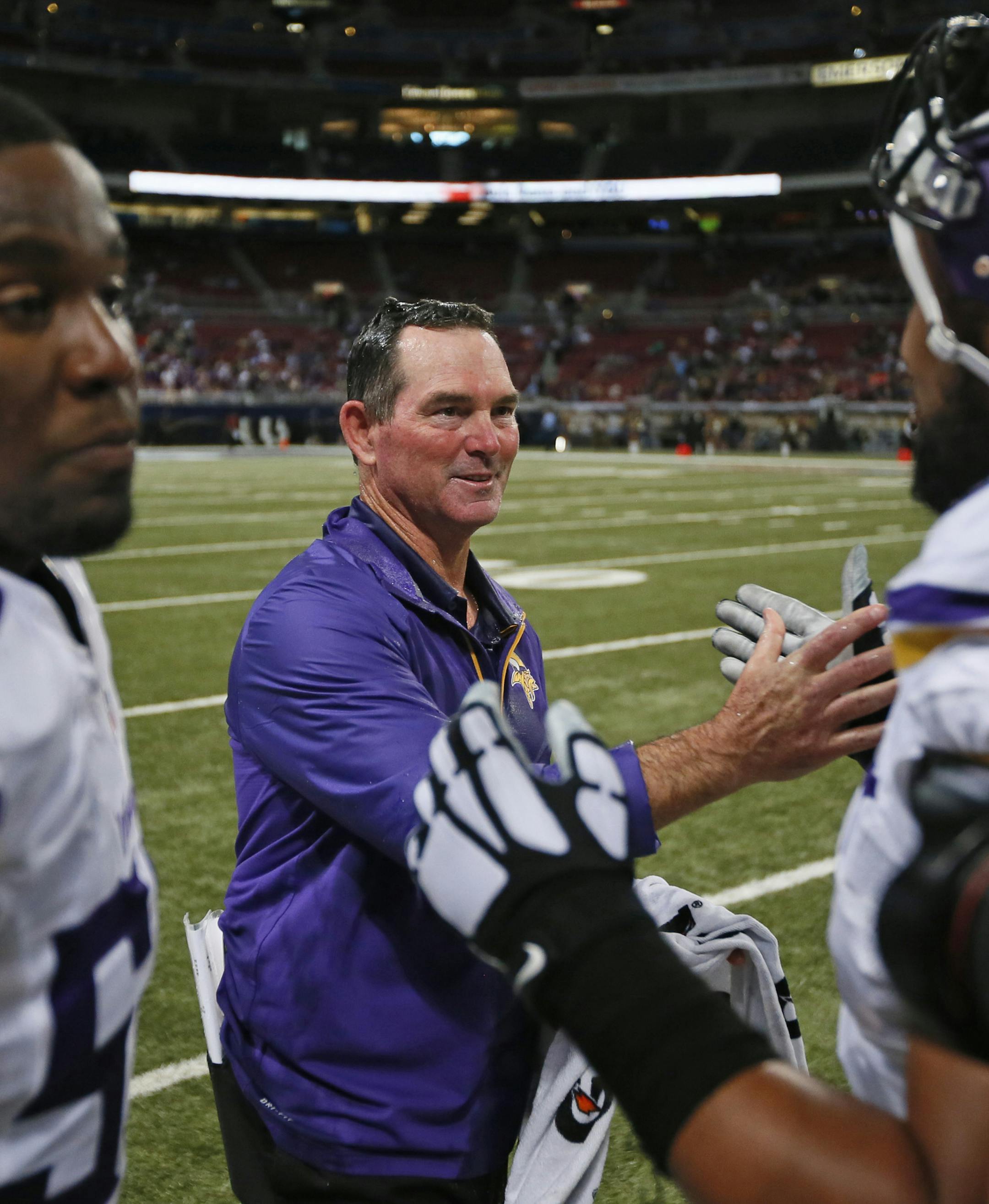 Vikings coach Mike Zimmer gets hand shakes from his players after the Vikings 34-6 victory over the St. Louis Rams Sunday in St. Louis. ] Minnesota Vikings -vs- St.Louis Rams, Edward Jones Dome. BRIAN PETERSON ‚Ä¢ brian.peterson@startribune.com St. Louis, MN 09/07/14