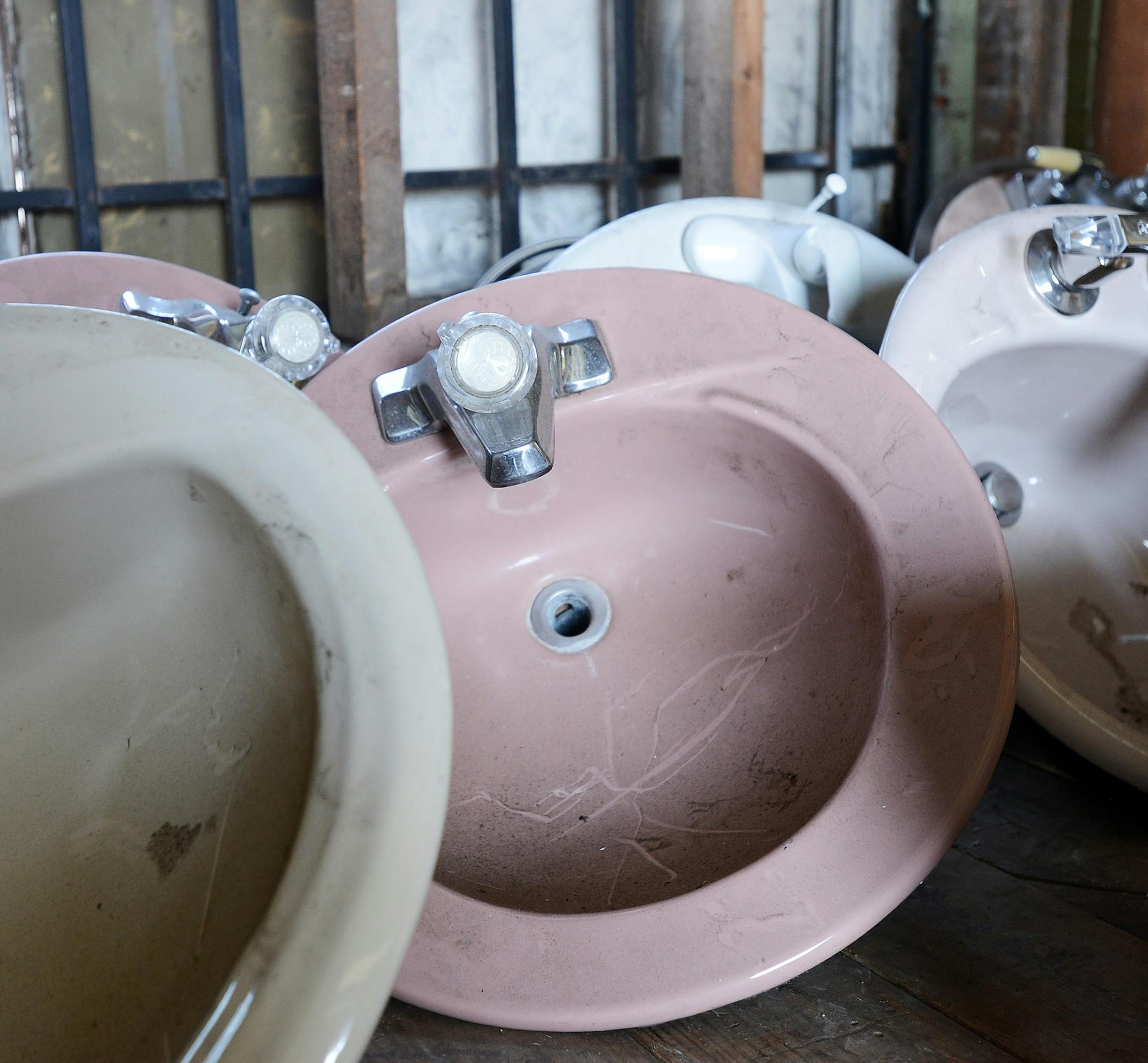 Many items for homes including sinks, toilets, doors, windows, bathtubs, etc. are for sale at the Architectural Salvage Warehouse in Detroit, seen in a May 13, 2014 photo. Detroit plans to start work soon on a pilot project to rescue and sell parts of deteriorating homes before demolishing them. The deconstruction project will solicit bids from teams to salvage reusable flooring, fixtures and moldings in 10 vacant buildings in one city neighborhood. (AP Photo/The Detroit News, Robin Buckson) DET