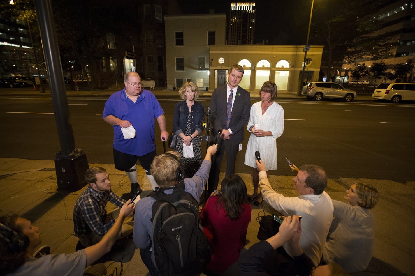 MinnMed CEO and Physician Kyle Kingsley, MD., second from right, addressed the media alongside Kim Kelsey, right, and Kathy Engstrom, both mothers of sons suffering from epilepsy, and Patrick McClellan, a medical marijuana user suffering from muscular dystrophy, early Wednesday morning after distributing medical marijuana prescriptions to the three.