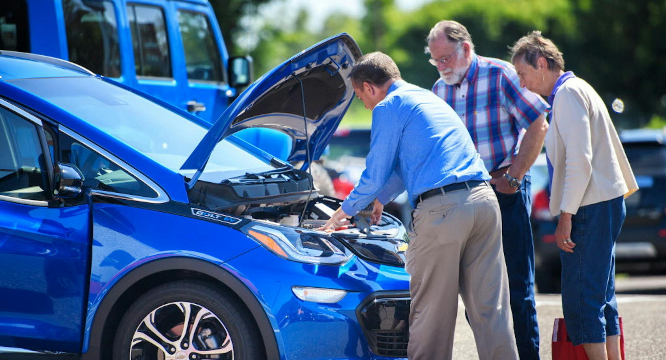 Rosedale Chevrolet salesman David Troy helped Van and Sue Gooch look over a Chevy Bolt electric vehicle. Van Gooch is a retired University of Minnesota biology professor and his Alexandria home is fitted with solar panels and is zero energy. ] GLEN STUBBE &#xef; glen.stubbe@startribune.com Friday July 7, 2017 Electric vehicles are poised to hit the mainstream with the rollout of the mass market Tesla this week, and Volvo's announcement it wil transition to all electric vehicles. We look at the i