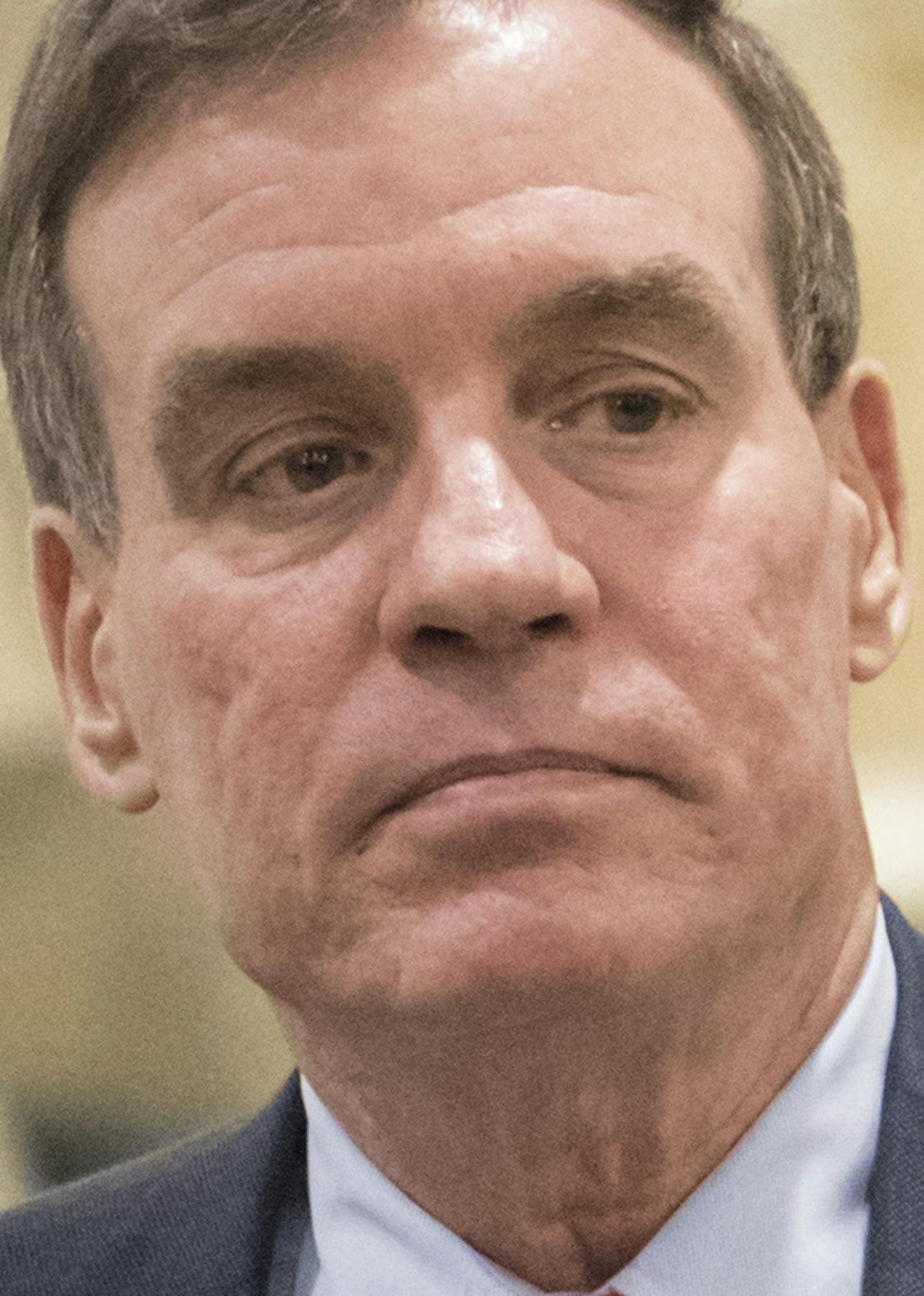 Senate Intelligence Committee Vice Chairman Sen. Mark Warner, D-Va. walks on Capitol Hill in Washington, Thursday, May 18, 2017, to a briefing by Deputy Attorney General Rod Rosenstein with the full Senate amid controversy over President Donald Trump's firing of FBI Director James Comey. (AP Photo/J. Scott Applewhite) ORG XMIT: DCSA117