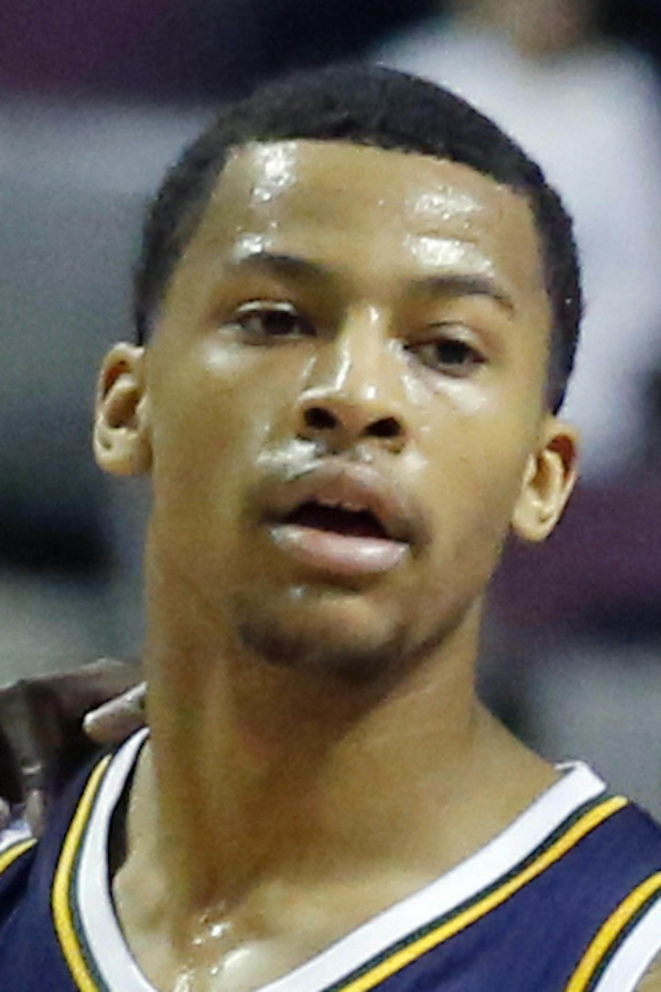 Utah Jazz forward Marvin Williams (2) talks with guard Trey Burke (3) during a timeout in the second half of an NBA basketball game against the Detroit Pistons on Friday, Jan. 17, 2014, in Auburn Hills, Mich. Burke led the Jazz with 20 points and 12 assists in their 110-89 win over the Pistons. (AP Photo/Duane Burleson)