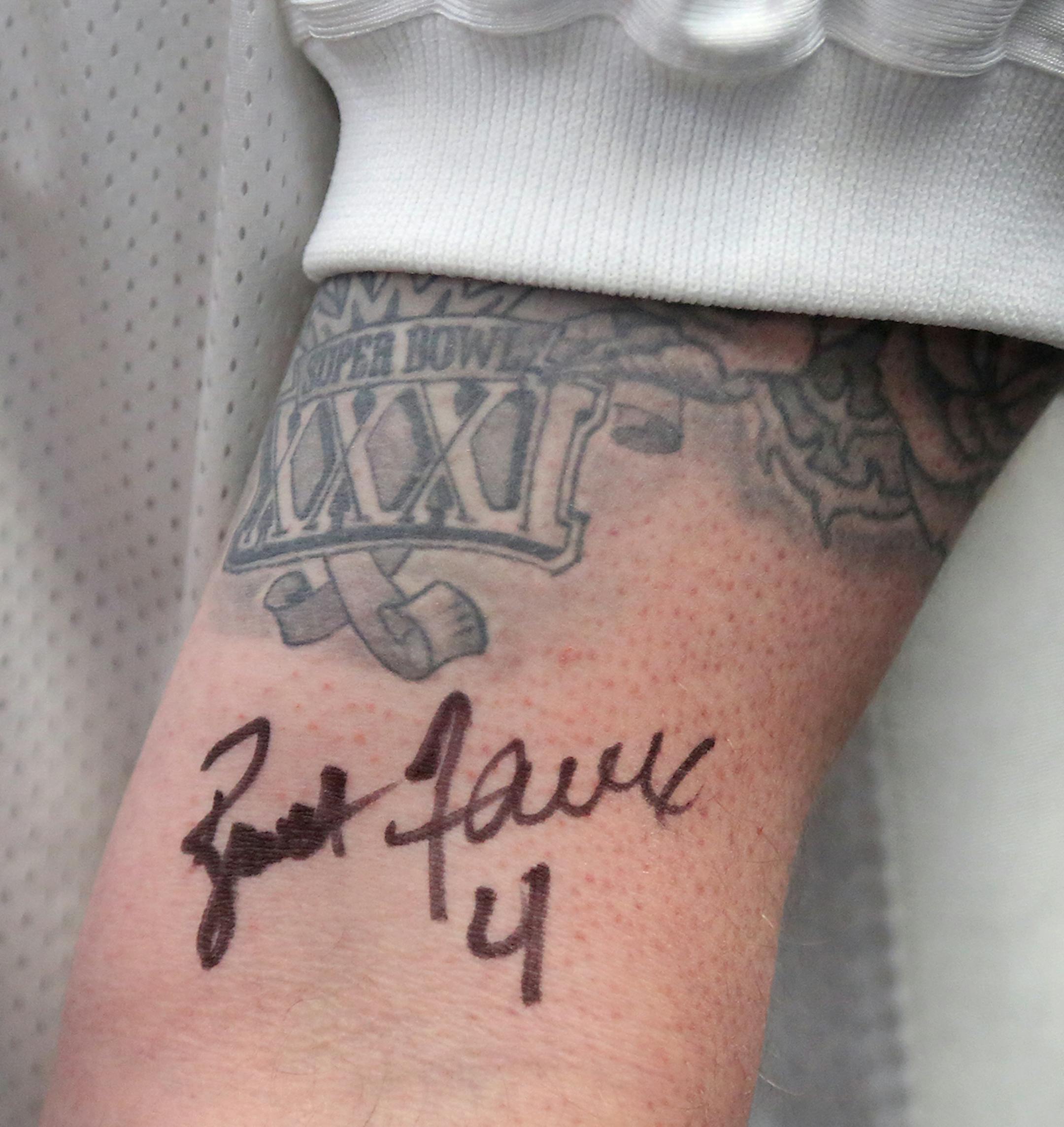 Favre superman Josh Boedigheimer of St. Paul with his freshly inked Brett Favre autograph. Former Green Bay Packers and Minnesota Vikings quarterback Brett Favre signed autographs and posed with fans for photos at Ridgedale Mall Saturday, Feb. 3, 2018, in Minnetonka, MN.] DAVID JOLES ï david.joles@startribune.com Former Green Bay Packers Quarterback Brett Favre will sign autographs for fans at the Ridgedale Mall Saturday.**Josh Boedigheimer of St. Paul,cq