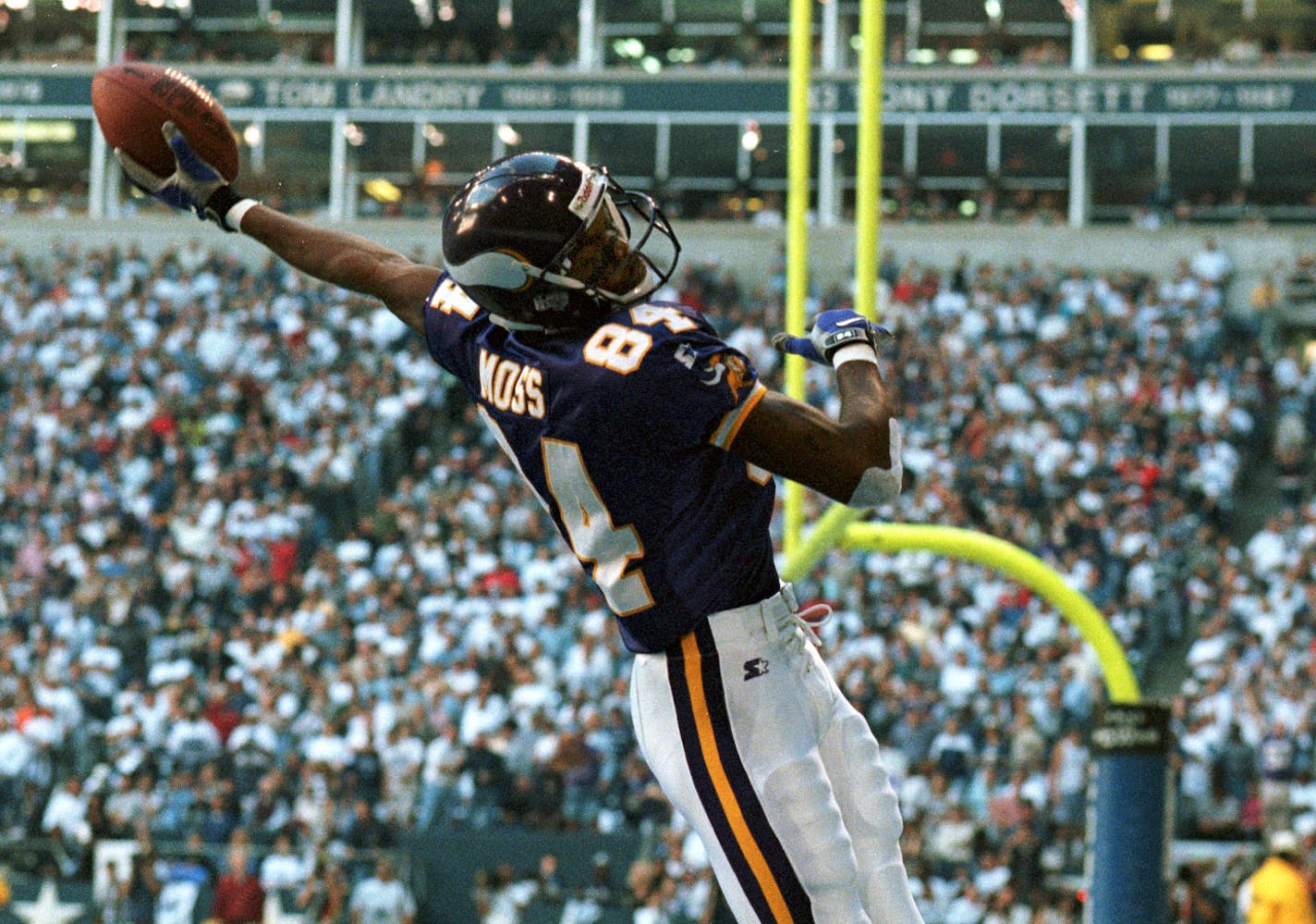 Vikings at Dallas Cowboys — Randy Moss celebrates after scoring his third touchdown of the game. It was a 56 yard reception.