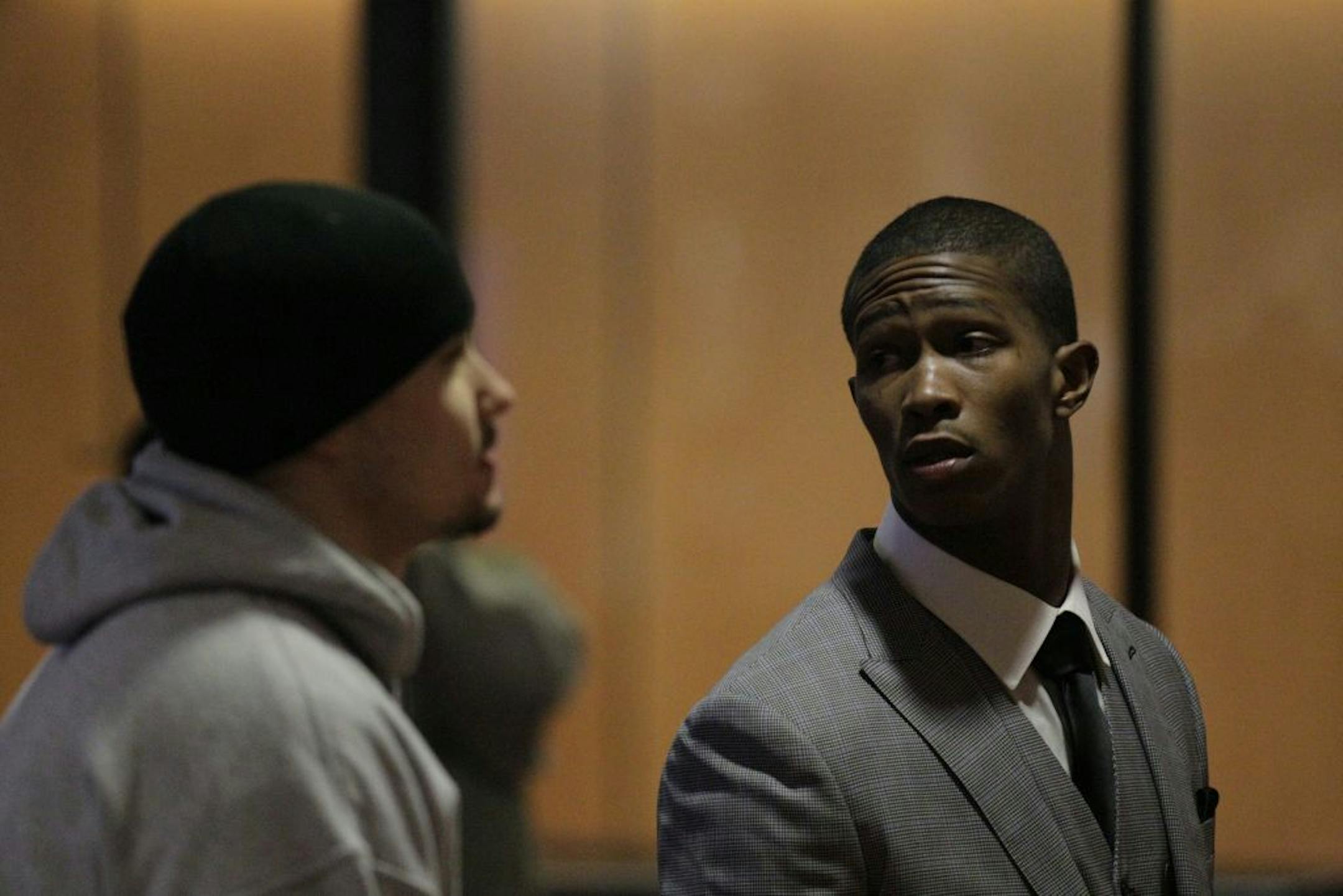 Vikings cornerback Chris Cook (right) arrived for a hearing in Minneapolis. Cook is accused of trying to choke his girlfriend.
