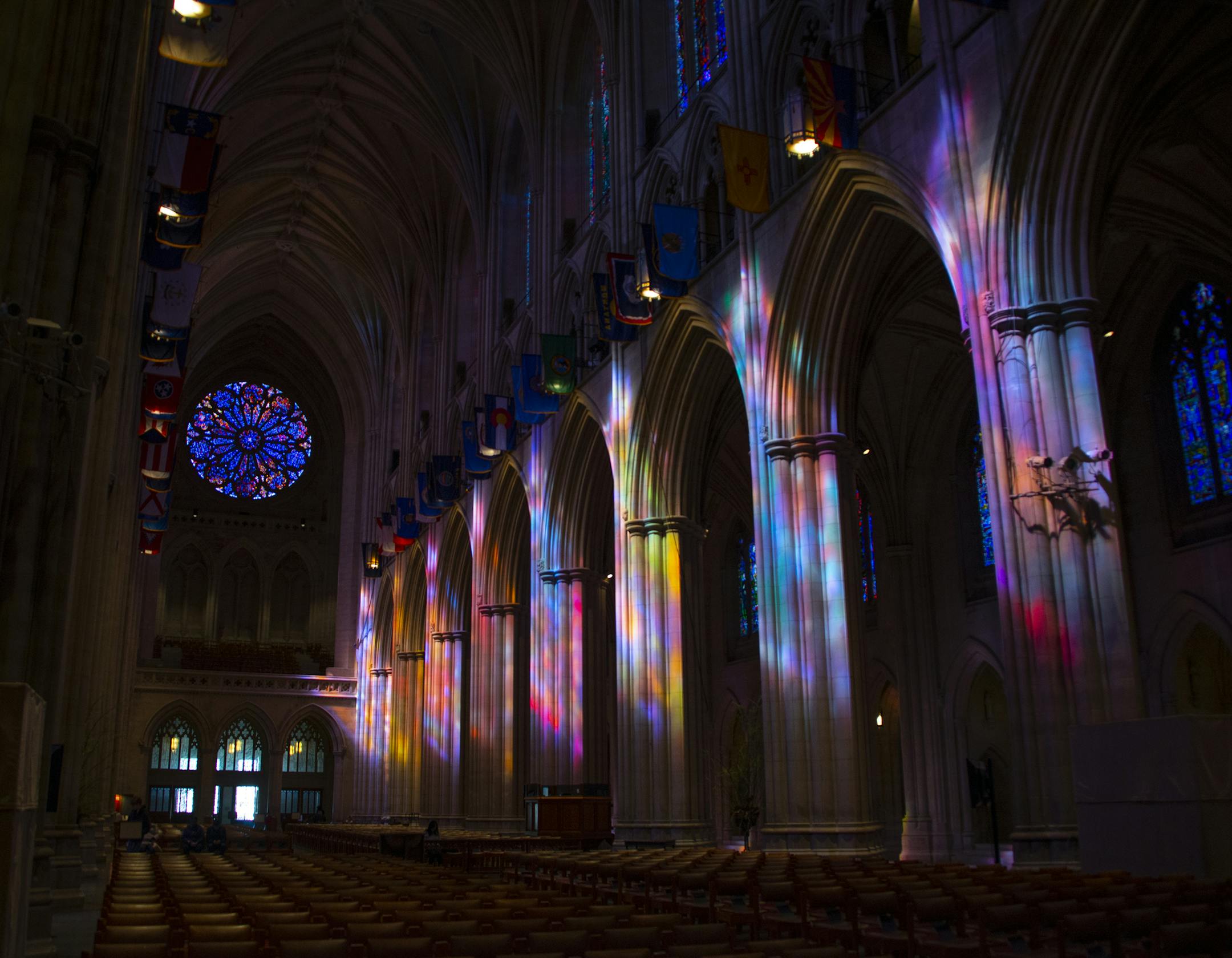 Morning light through the stained glass windows casts a colorful display on the walls of the National Cathedral in Washington D.C. John Piepkorn