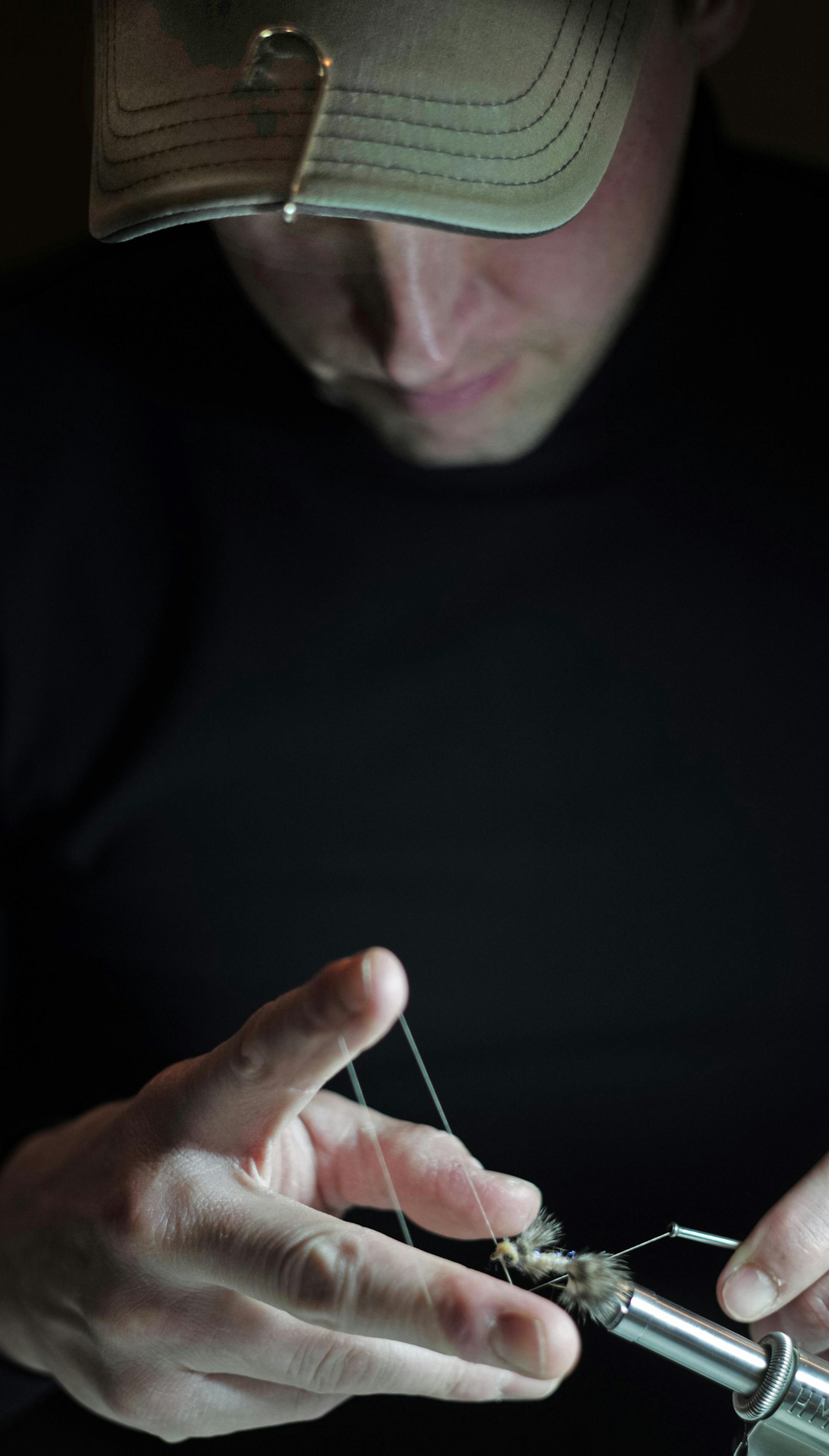 At Schroeder's Bar & Grill in St. Paul, Joe Schreifels, ties a steelhead fly with the precision of a surgeon.]richard tsong-taatarii/rtsong-taatarii@startribune.com ORG XMIT: MIN1312262205544182