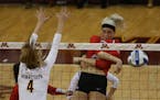 Ohio State's Taylor Sandbother hit the ball passed Gopher's Paige Tapp during the second set.