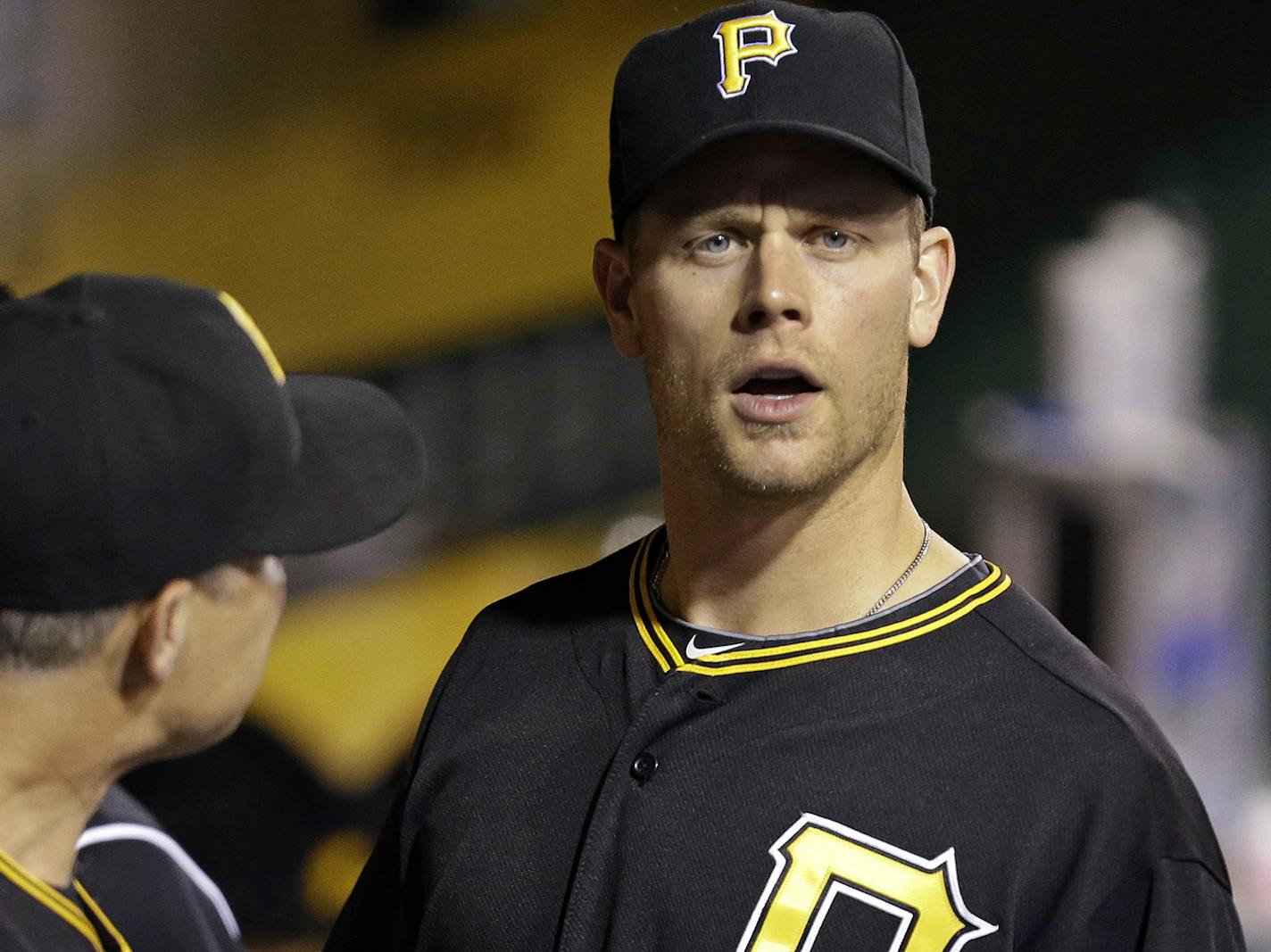 Pittsburgh Pirates' Justin Morneau, right, talks with Pirates hitting coach Jay Bell (3) in the dugout during a baseball game against the St. Louis Cardinals in Pittsburgh Saturday, Aug. 31, 2013. Morneau was acquired from the Minnesota Twins. (AP Photo/Gene J. Puskar) ORG XMIT: MIN2013083120431334