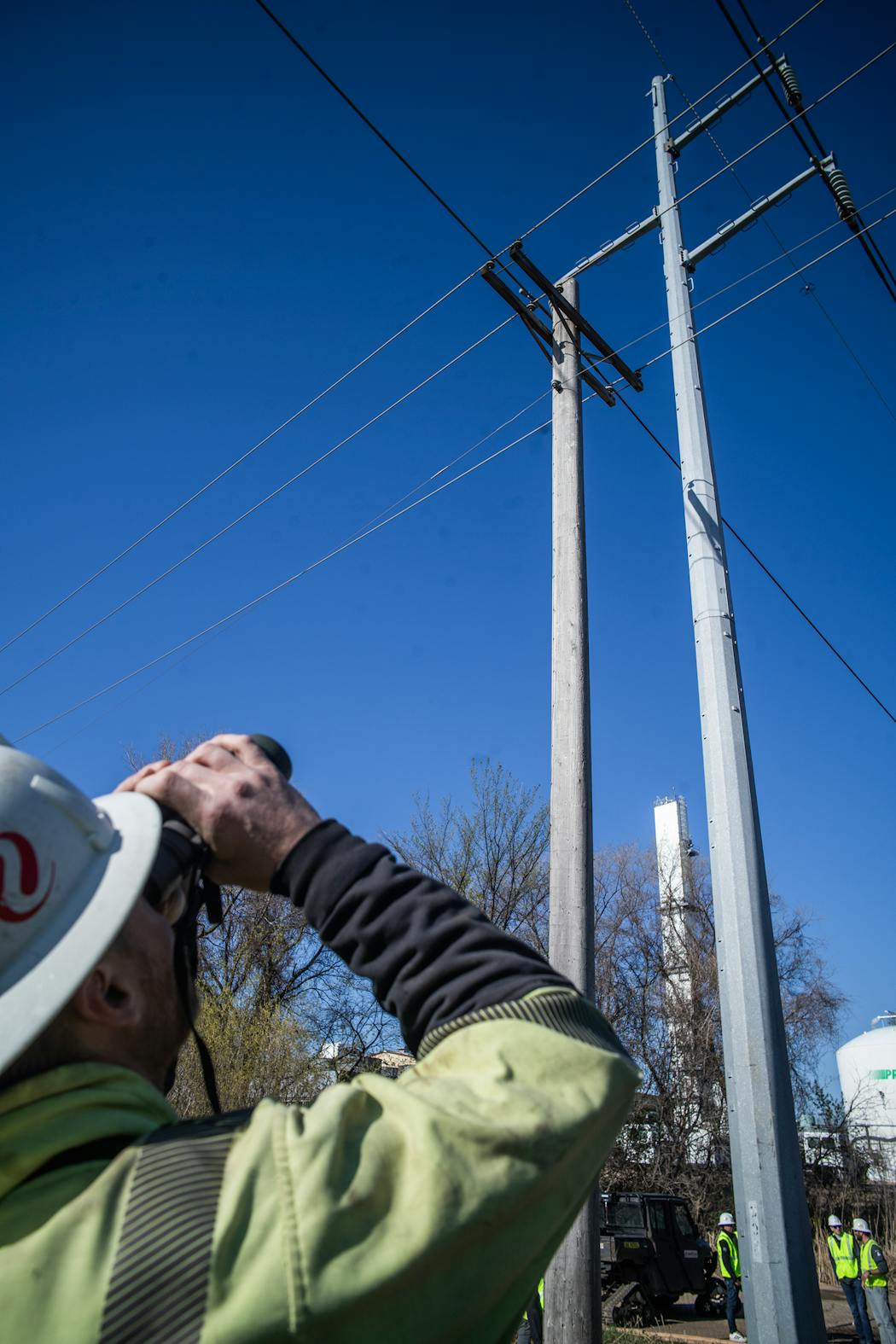 Lineman Bobby Weber inspects a power line pole in Inver Grove Heights on April 24. Utilities including Xcel Energy are managing a future with bigger and stronger wildfires that threaten their operations and have caused lawsuits against them worth potentially hundreds of millions of dollars in damages.