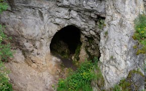Denisova Cave in Russia where a bone fragment was found that scientists believe belonged to an adolescent girl whose parents were a Neanderthal and a 