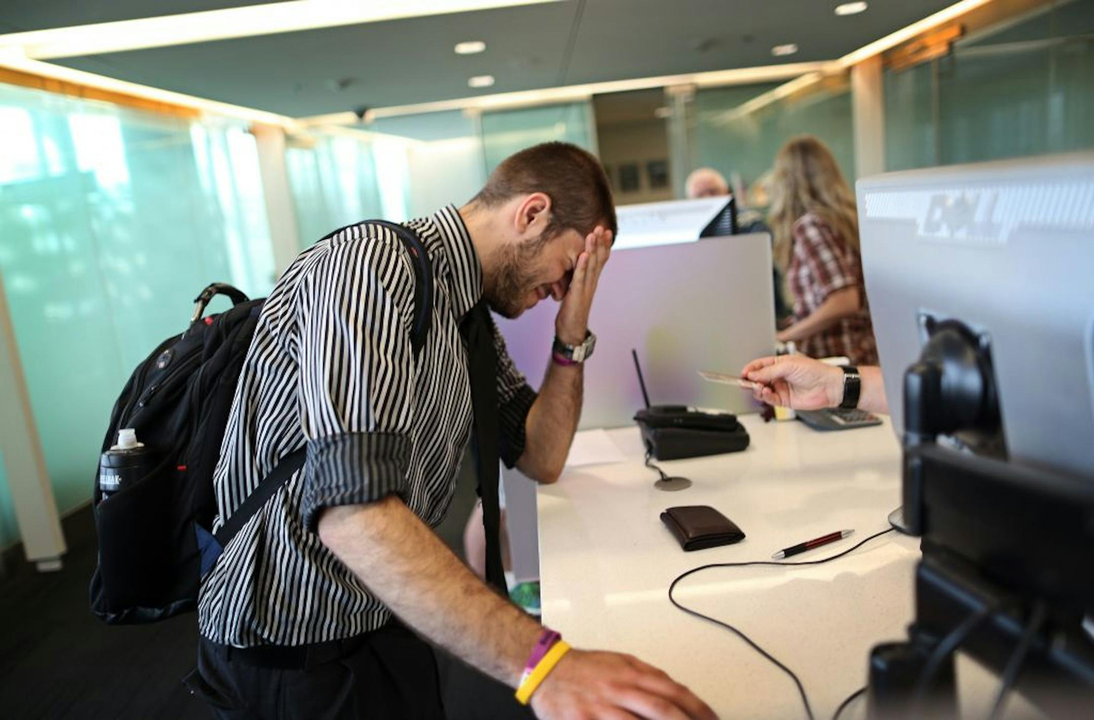Allen Saakyan, 19, of Sioux Falls, S.D., a sophomore at the University of Minnesota, waited Tuesday to find out why next semester's financial aid was on hold.