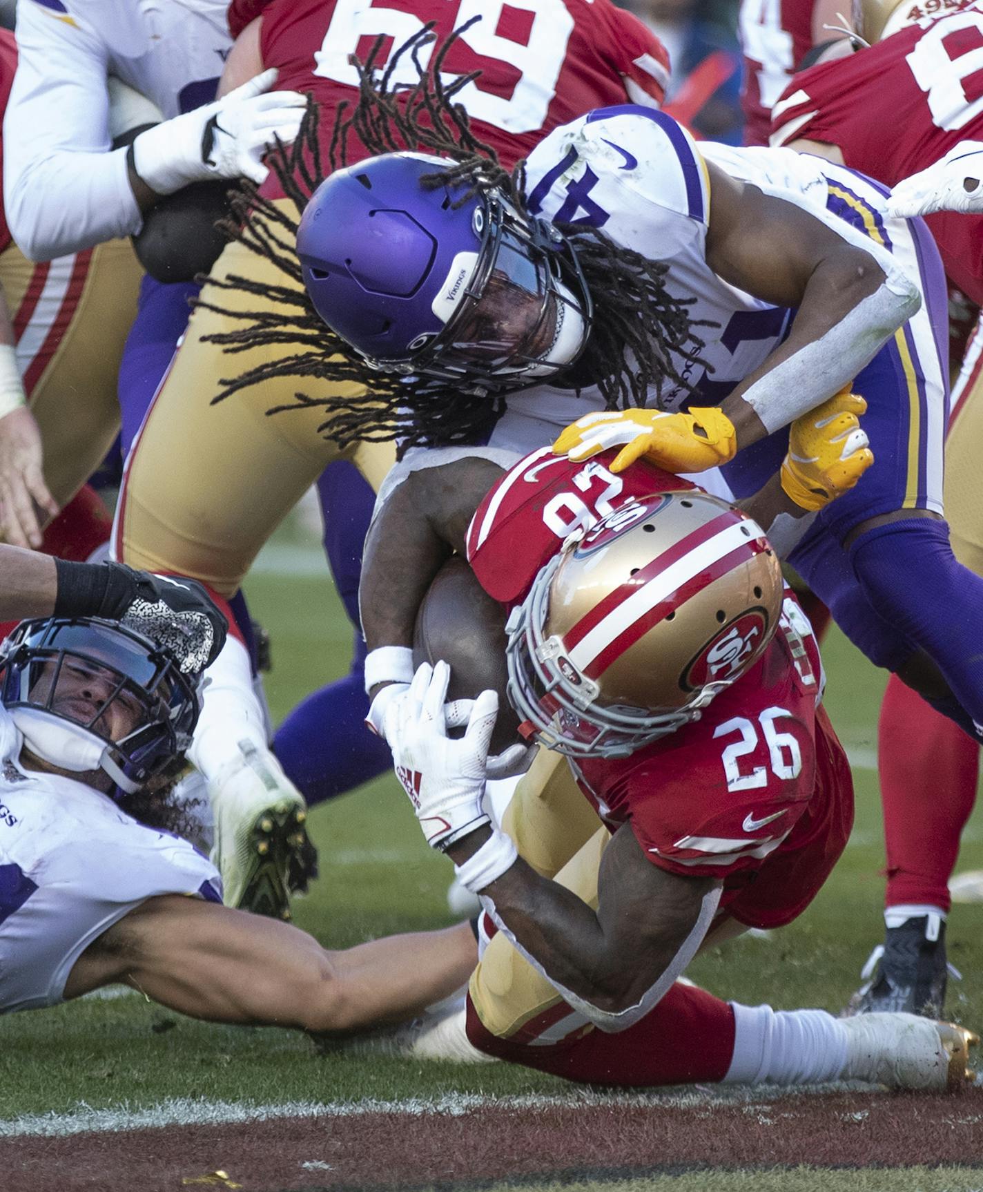 San Francisco 49ers running back Tevin Coleman plowed through Minnesota Vikings middle linebacker Eric Kendricks, left, and defensive back Anthony Harris for a touchdown in the third quarter. ] ELIZABETH FLORES &#x2022; liz.flores@startribune.com The Minnesota Vikings take on the San Francisco 49ers in a playoff game at Levi's Stadium, Saturday, January 11, 2020 in Santa Clara, CA. ORG XMIT: MIN2001111908250451