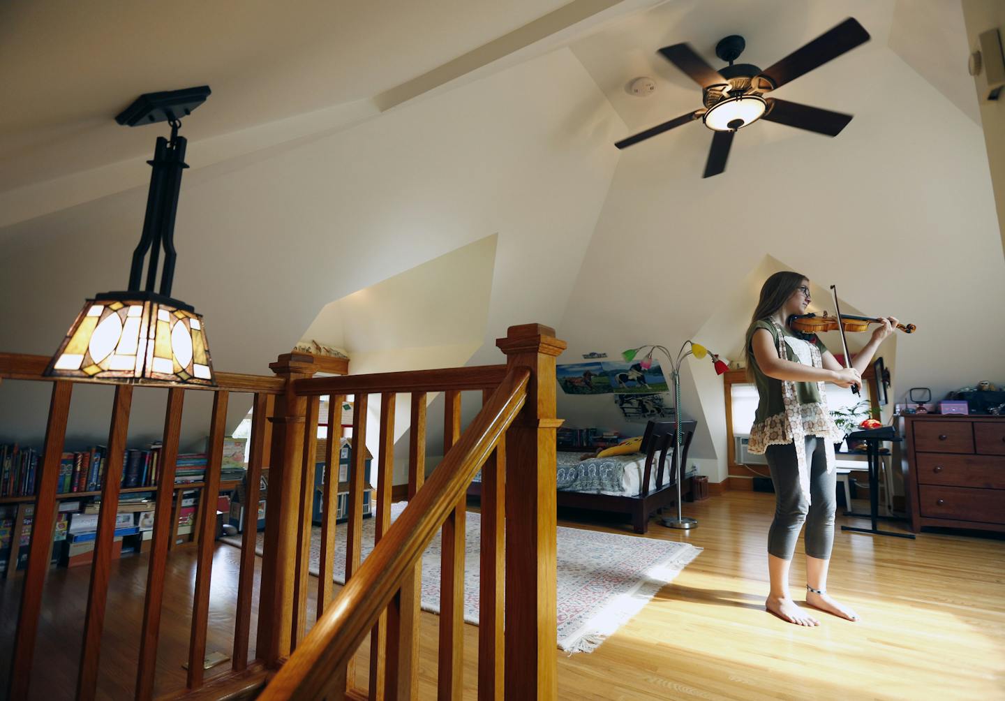 Margaret Durant practices her violin in her super-private attic bedroom in her family's 1909 Craftsman foursquare in St. Paul.