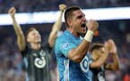 Minnesota United's Vito Mannone, foreground, celebrates with his team after a win over FC Dallas in an MLS soccer match Saturday, July 13, 2019, in St