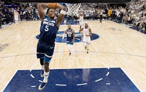 The Wolves' Anthony Edwards flies in for a dunk in the first quarter Saturday at Target Center.