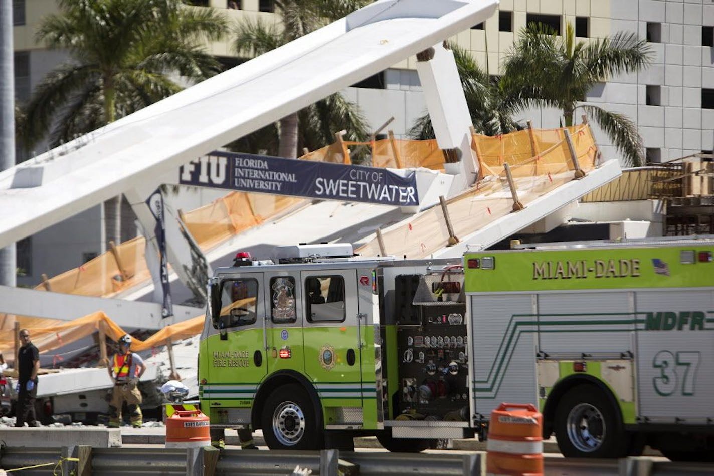 Responders on the scene of the FIU pedestrian bridge collapse Thursday, March 15, 2018 at SW 109th Avenue and 8th Street in Miami, trapping unknown numbers of people beneath.