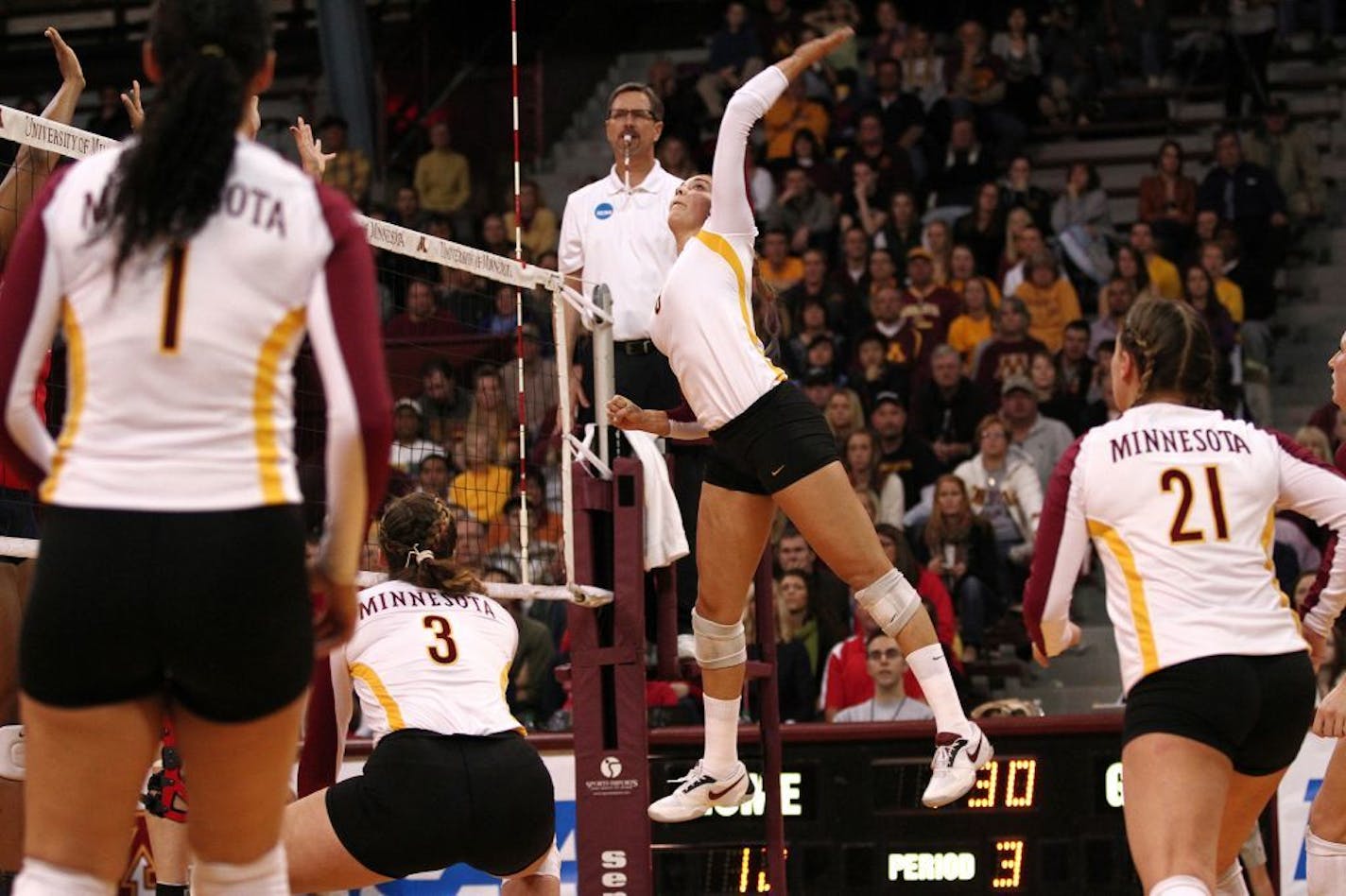 Minnesota's Katherine Harms spiked the ball over the net.