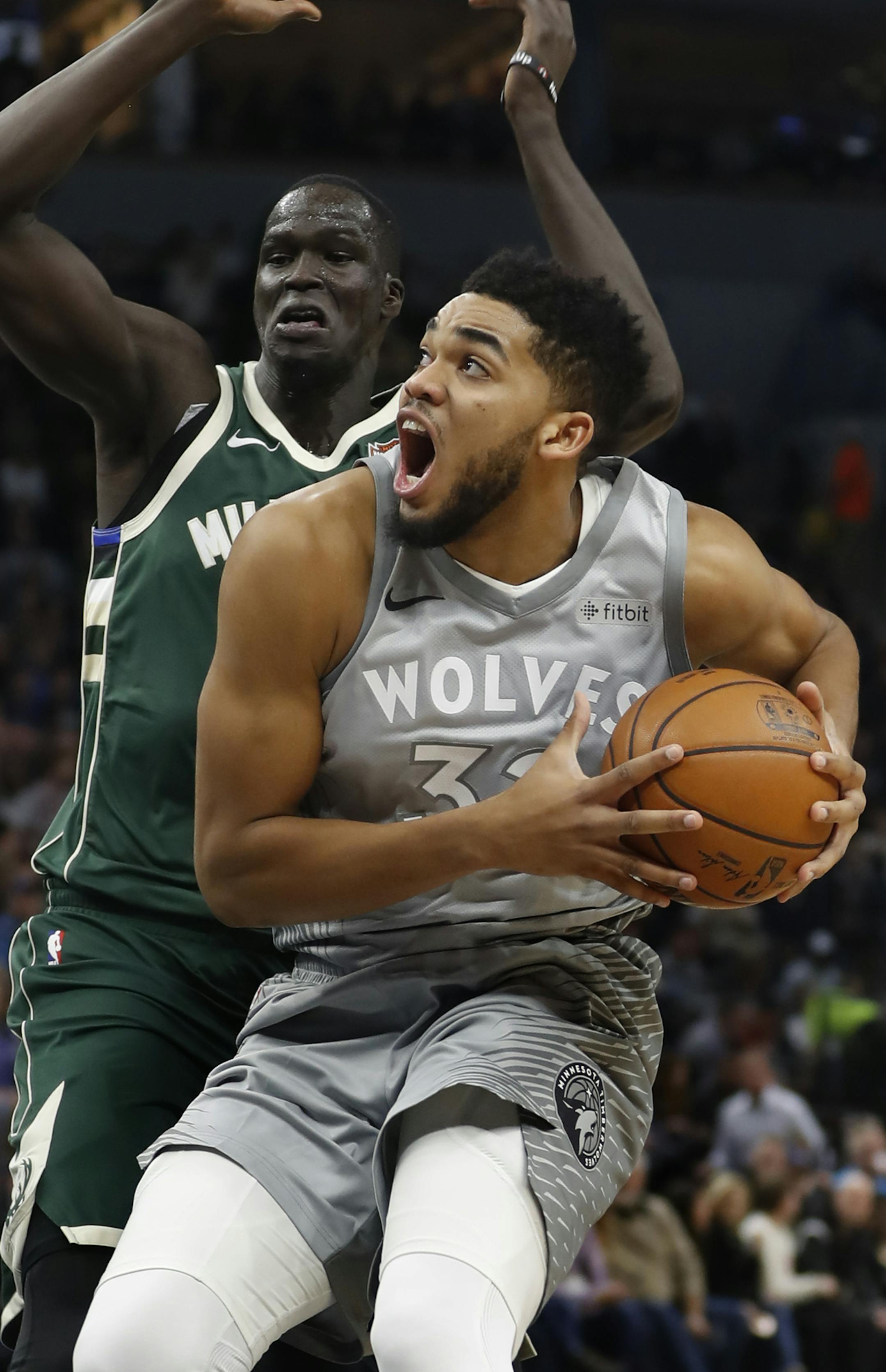 Karl-Anthony Towns(32) penetrated past Thon Maker(7) of the Bucks.]Timberwolves play Milwaukee Bucks at Target Center on 2/1/2018. the Richard Tsong-Taatarii&#xef;rtsong-taatarii@startribune.com