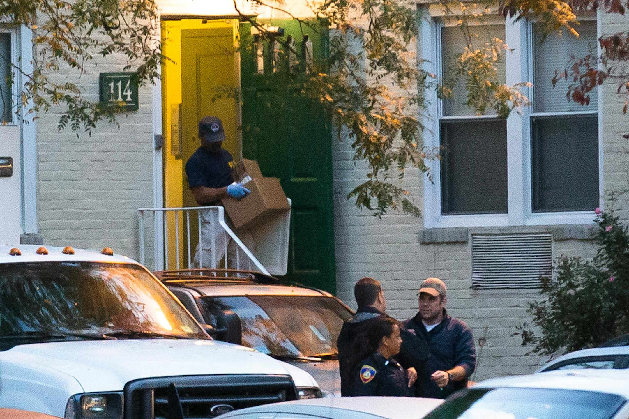 A federal agent removes evidence from the apartment complex where Miriam Carey is believed to have lived in Stamford, Conn., Friday, Oct. 4, 2013. Law-enforcement authorities have identified Carey, 34, as the woman who, with a 1-year-old child in her car, led Secret Service and police on a harrowing chase in Washington from the White House past the Capitol Thursday, attempting to penetrate the security barriers at both national landmarks before she was shot to death, police said. The child survi
