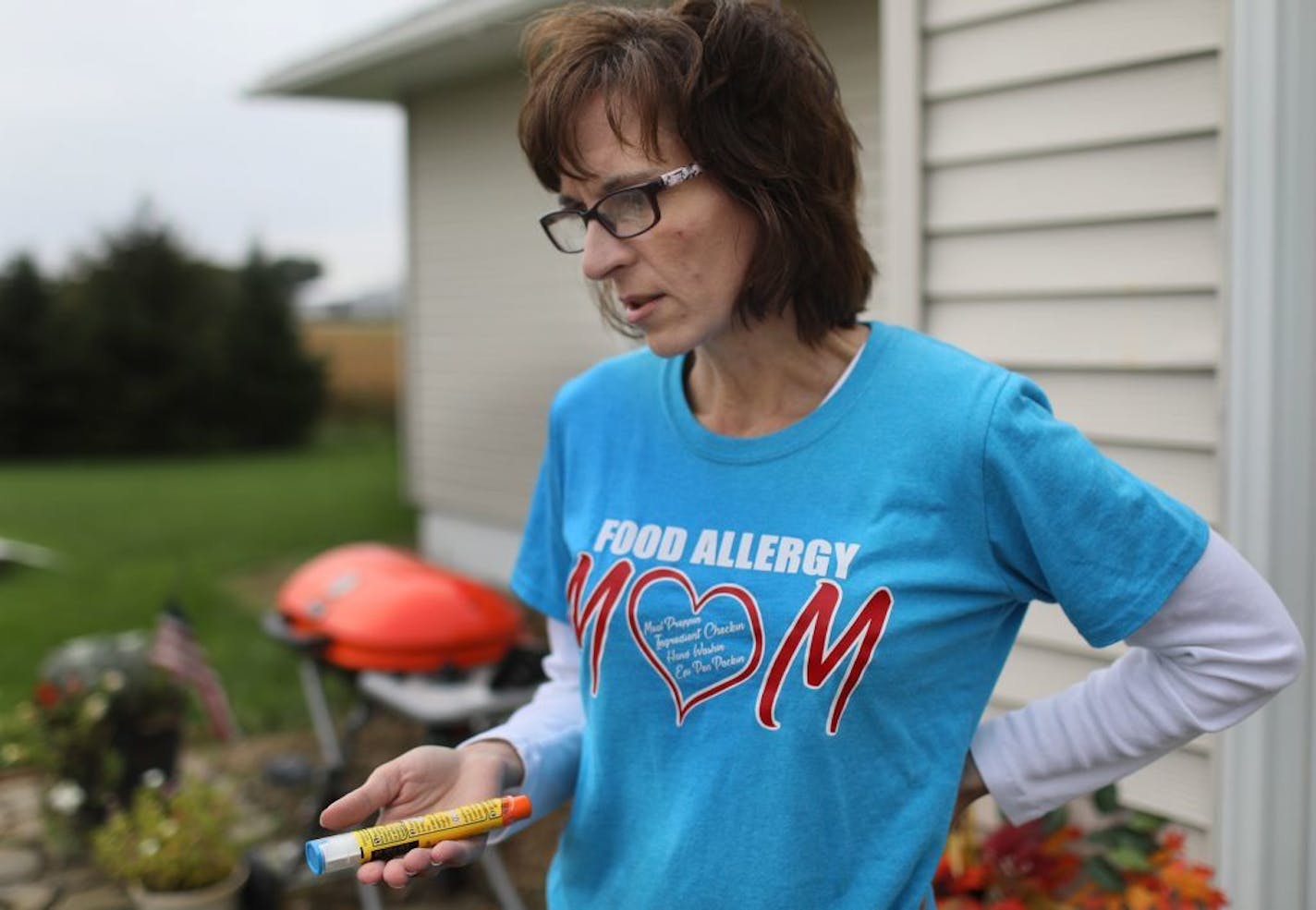 Mary Schlief, who has a medication allergy and also has two sons with food allergies, understands that Mylan's EpiPen can be a life saver for her and her children and keeps them close by. "This is the only thing that buys you time to get to the hospital," said Schlief, holding an EpiPen, who had a medication allergy in 2013 due to a change in an insulin brand for diabetes that required using an EpiPen to save her life but the episode left her in a hospital ICU for four days. Here, Schlief, held