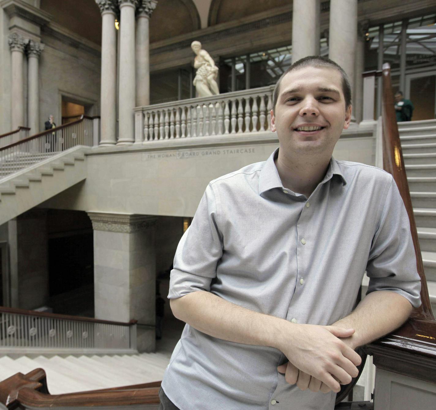 In this photo made Wednesday, Oct. 14, 2009, Andrew Mason of Groupon, a online startup for bargain hunters looking for group discounted sales, stands on the grand staircase of the Art Institute of Chicago, one of his company's clients, in Chicago. (AP Photo/M. Spencer Green) ORG XMIT: MIN2013030720035793