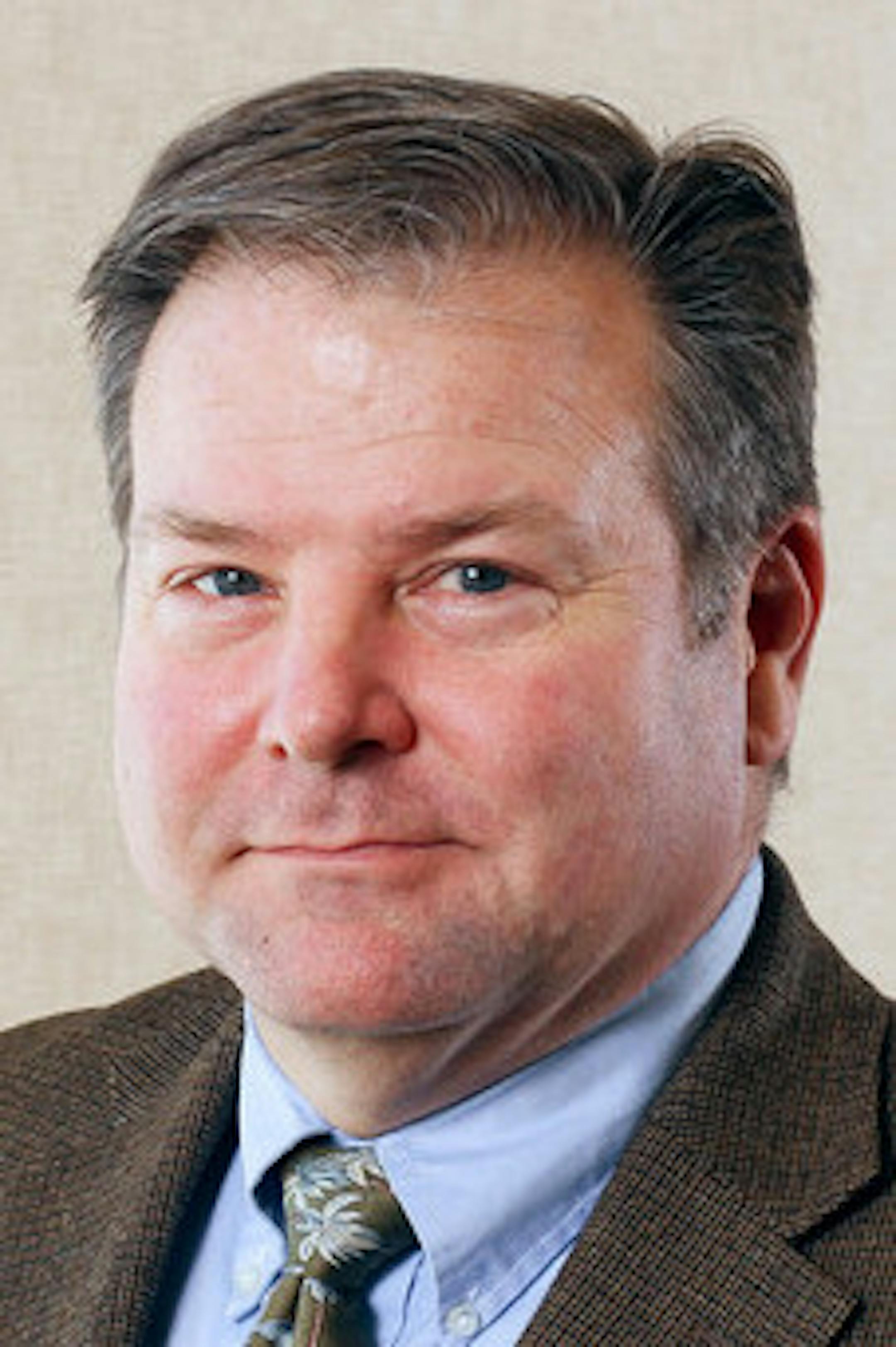 Environmental portrait of Mike Porter taken on Friday, March 8, 2013 on the St. Paul campus of the University of St. Thomas. ORG XMIT: MIN1411181529556585