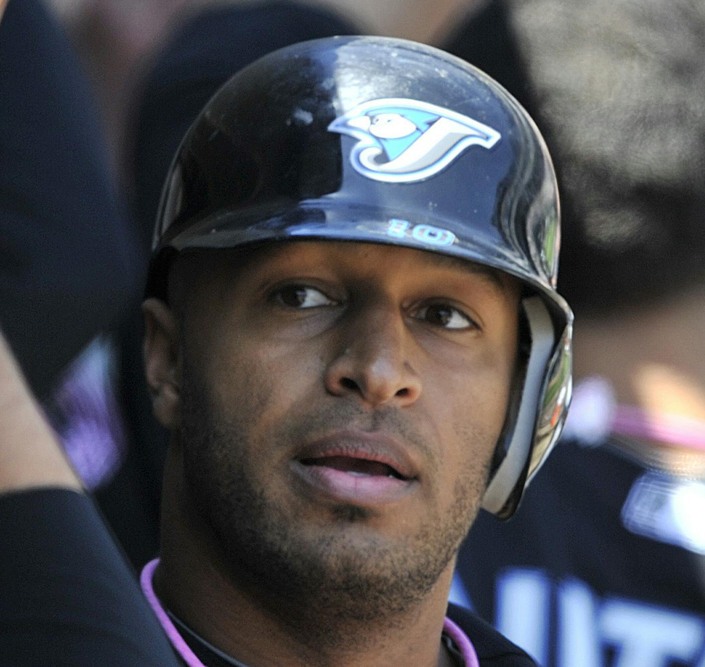 Toronto Blue Jays' Vernon Wells, right, is congratulated by teammates after his two run home run against the Chicago White Sox during the third inning of a baseball game Sunday, May 9, 2010, in Chicago. (AP Photo/Jim Prisching) ORG XMIT: ILJP106