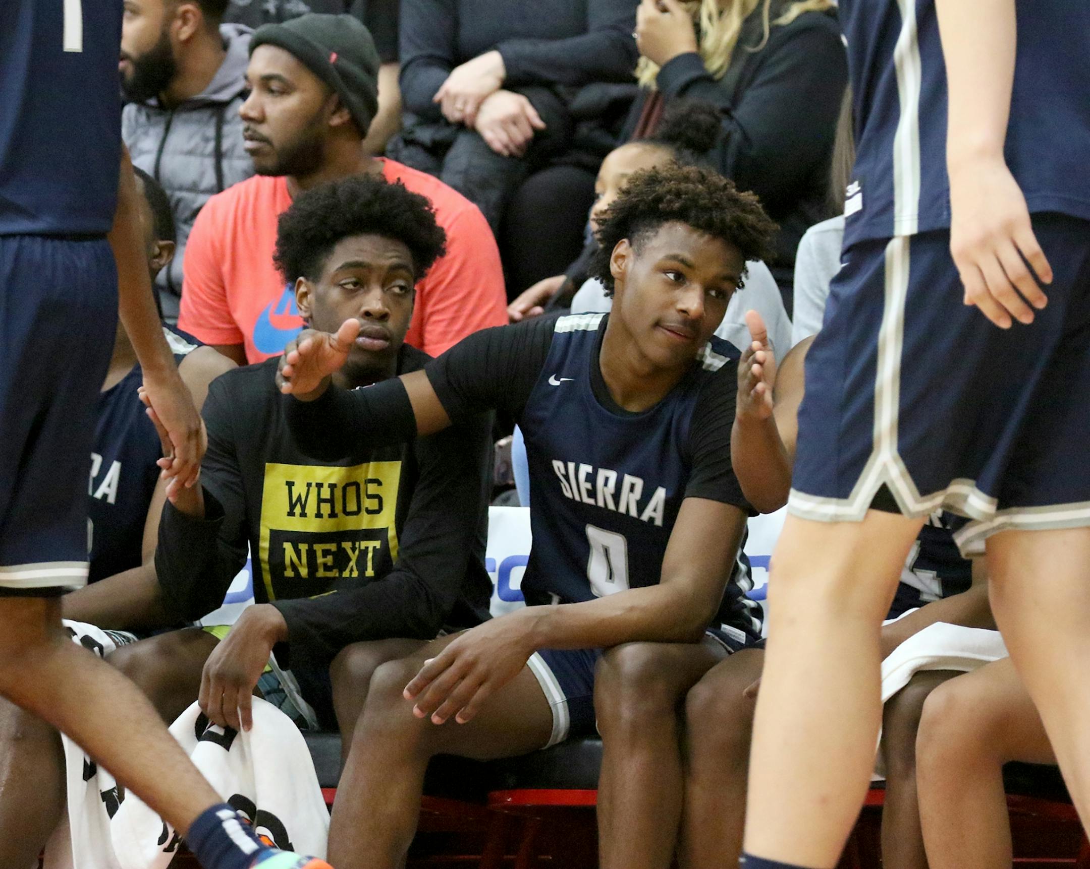 Zaire Wade, left, and Bronny James, right, of Sierra Canyon, started the game on the bench during their game with The Patrick School Friday, Jan. 3, 2020, at Minnehaha Academy in Minneapolis MN.