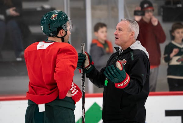 Wild interim coach Dean Evason spoke with Luke Kunin during a February practice at Tria Rink in St. Paul. The NHL and the players reached agreement Mo