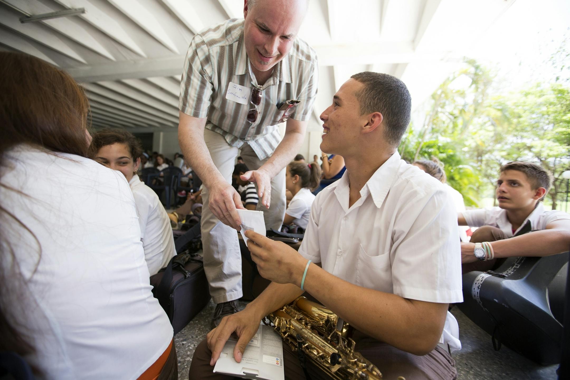 Student Oquiel Diaz accepts reed vitalizer as a gift from Minnesota Orchestra saxophone player Jim Romain at the Escuela Nacional de Musica in Havana, Cuba on Thursday, May 14, 2015.