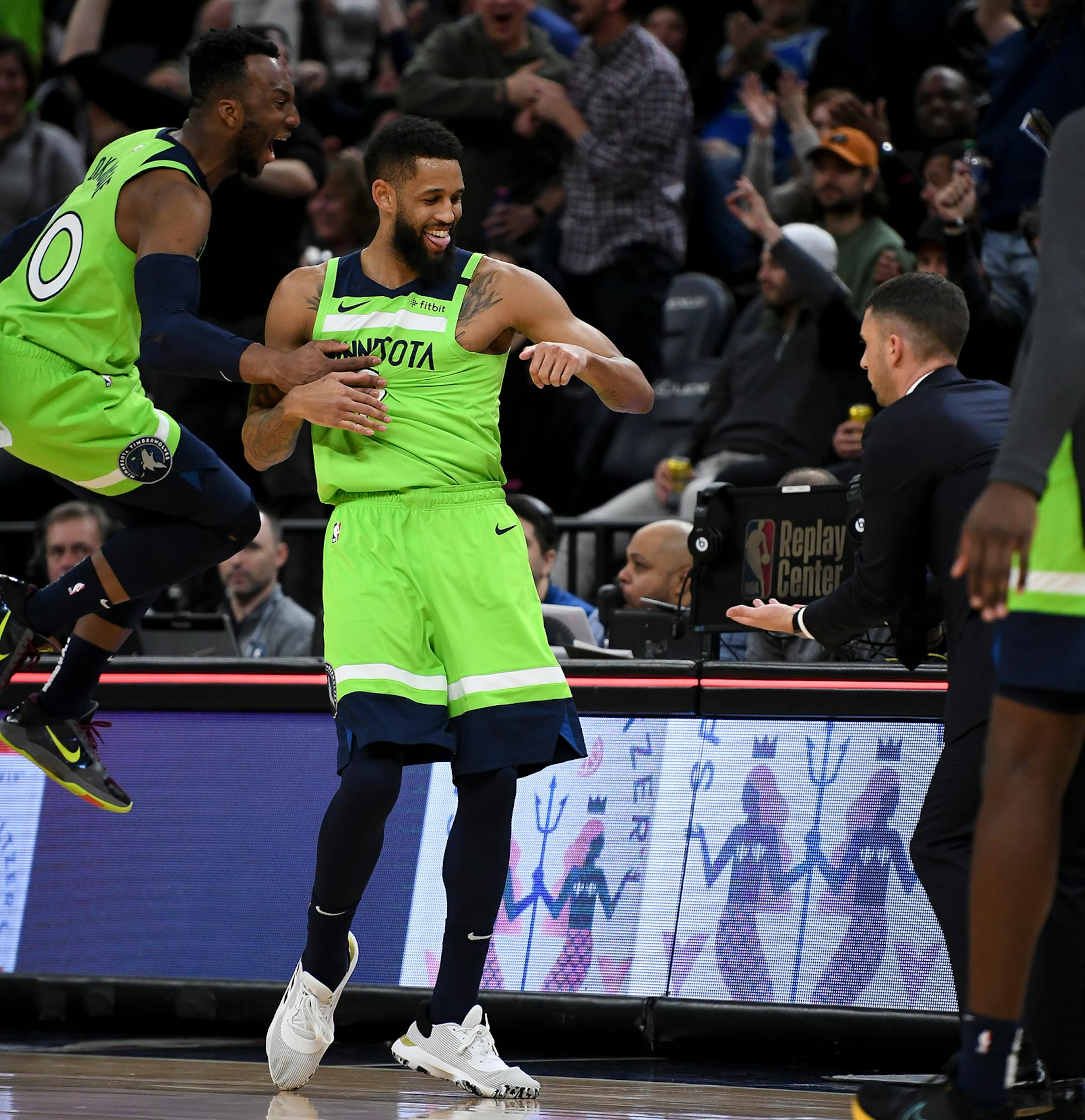 Minnesota Timberwolves guard Josh Okogie (20) and head coach Ryan Saunders celebrated with guard Allen Crabbe (9) after his buzzer beating shot to end the third quarter against the LA Clippers.
