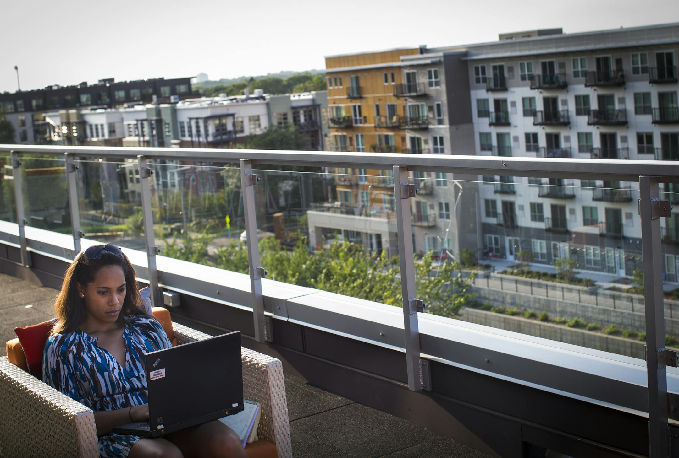 The rise of luxury apartments is transforming uptown Minneapolis as never before. Jenny Crump worked on her laptop from the 6th floor deck of Lime with a view of several other new apartments and condos on Thursday, August 21, 2014 in Minneapolis, Minn. Crump moved into Lime three weeks ago. ] RENEE JONES SCHNEIDER &#x201a;&#xc4;&#xa2; reneejones@startribune.com