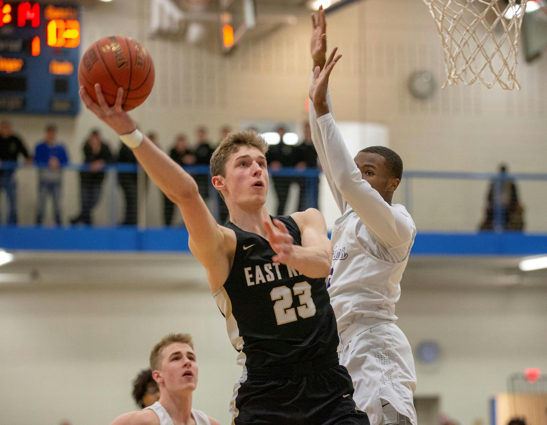 East Ridge's Ben Carlson goes up for two of his team-high 26 points against Cretin-Derham Hall Thursday night. The Raptors advanced to next week's State Tournament with a 71-45 victory over the Raiders. Photo by Jeff Lawler, SportsEngine