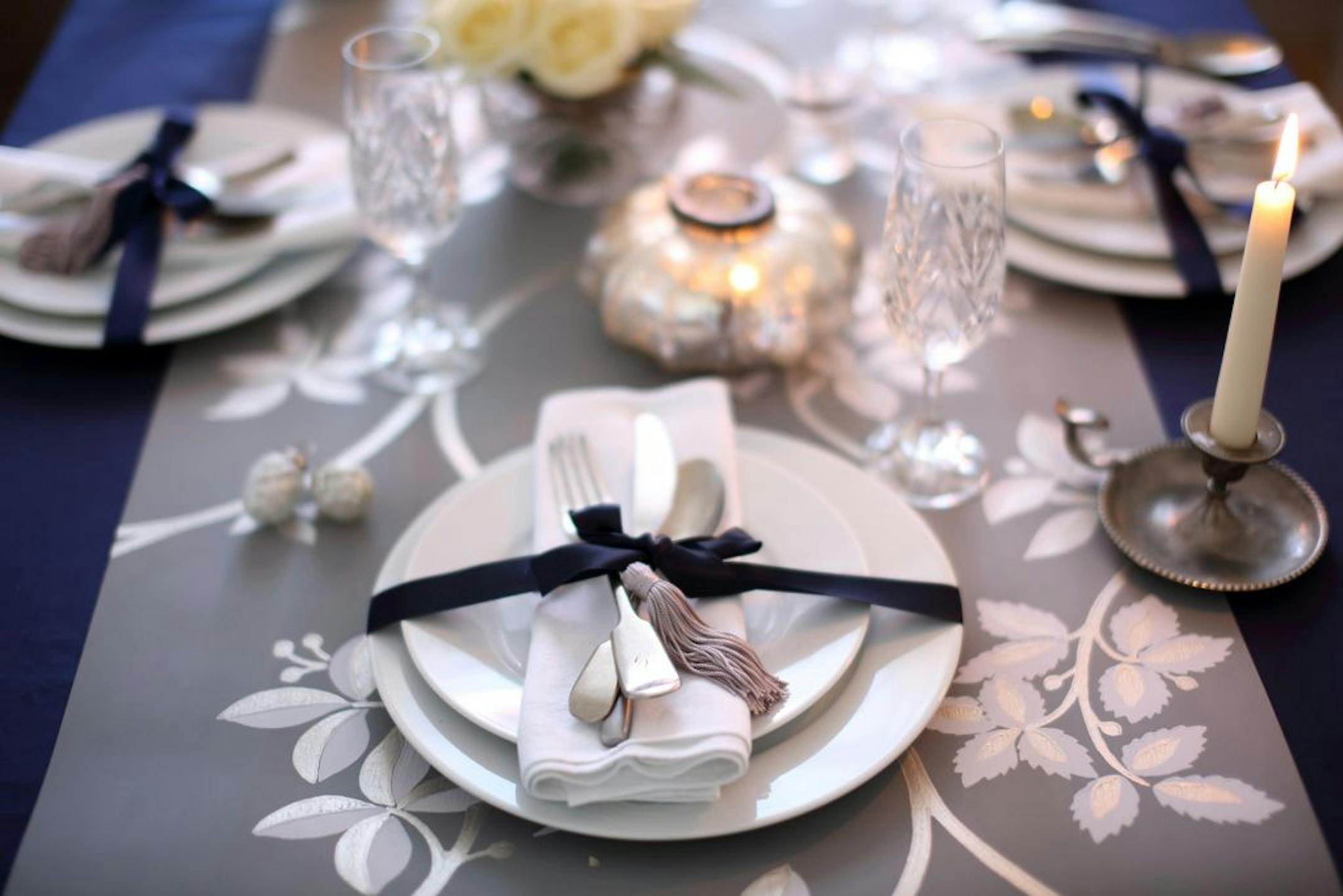 Farrow & Ball wallpaper is repurposed as an elegant table runner for the holiday season. A 16- by 4-foot roll is $50.