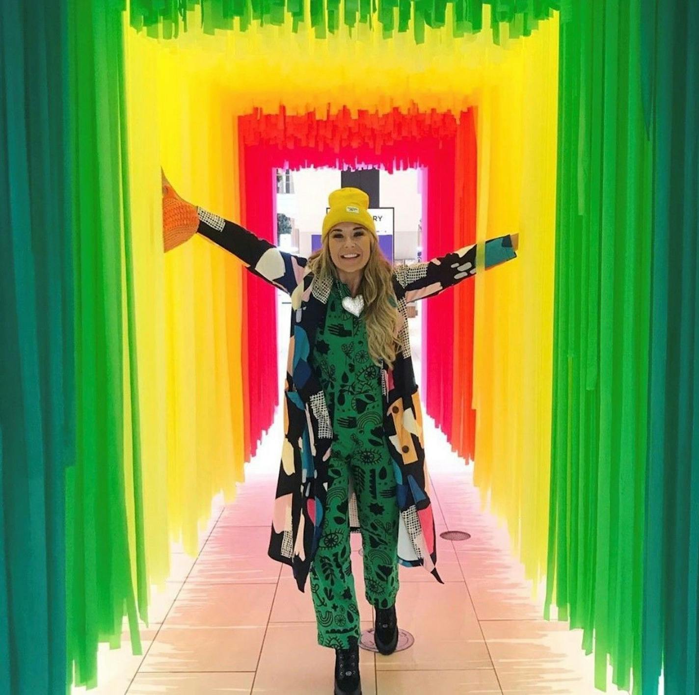 Social influencer Sarah Edwards is pictured walking through an art installation at Rosedale Center. Photo provided by Sarah Edwards